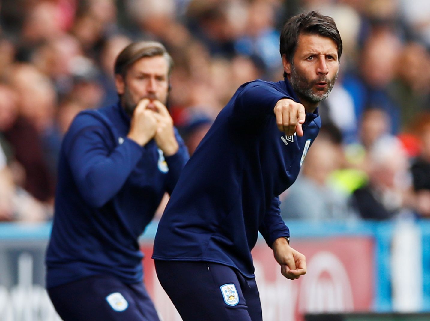 Soccer Football - Championship - Huddersfield Town v Sheffield Wednesday - John Smith's Stadium, Huddersfield, Britain - September 15, 2019   Huddersfield Town manager Danny Cowley and assistant manager Nicky Cowley gesture    Action Images/Jason Cairnduff    EDITORIAL USE ONLY. No use with unauthorized audio, video, data, fixture lists, club/league logos or "live" services. Online in-match use limited to 75 images, no video emulation. No use in betting, games or single club/league/player public