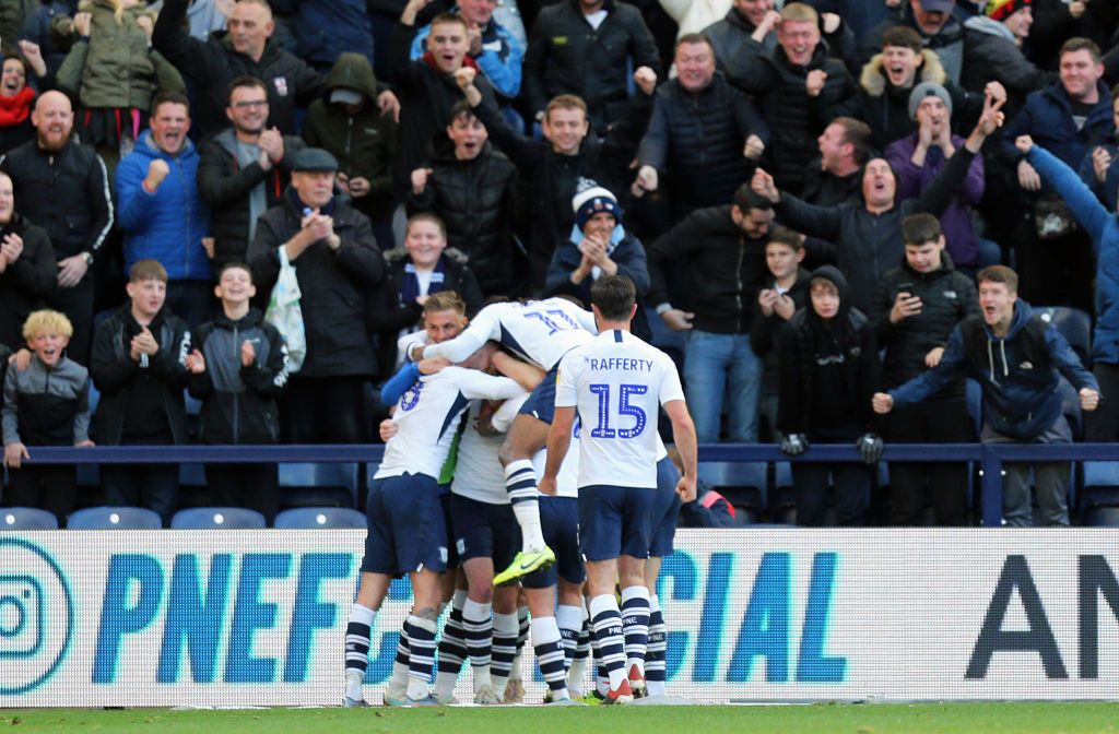 PRESTON, ENGLAND - OCTOBER 26: Preston North End's Tom Barkhuizen is mobbed by team-mates as he celebrates scoring his side's third goal during the Sky Bet Championship match between Preston North End and Blackburn Rovers at Deepdale on October 26, 2019 in Preston, England. (Photo by Rich Linley - CameraSport via Getty Images)