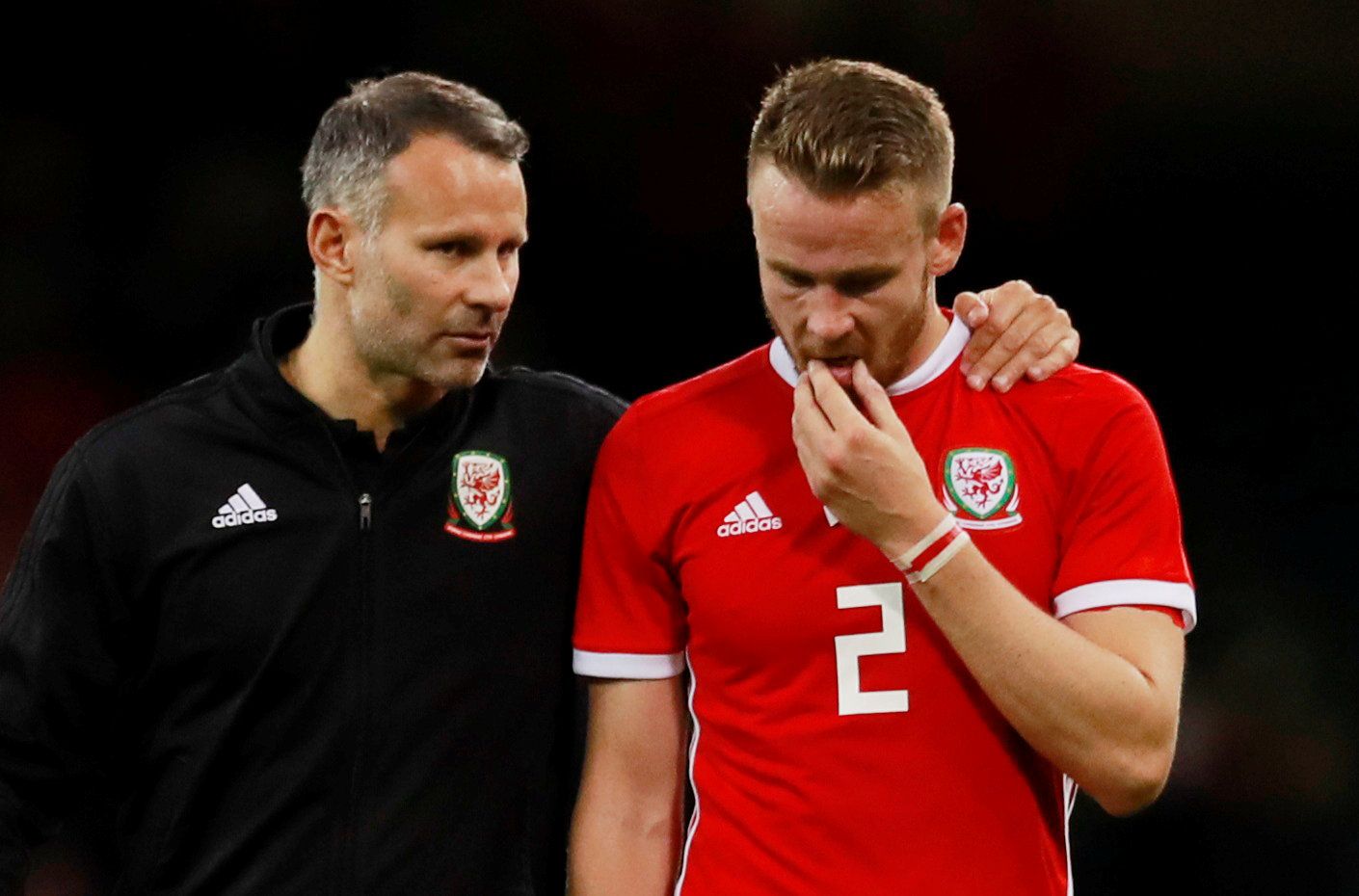 Soccer Football - International Friendly - Wales v Spain - Principality Stadium, Cardiff, Britain - October 11, 2018  Wales manager Ryan Giggs and Chris Gunter look dejected after the match   Action Images via Reuters/Andrew Couldridge