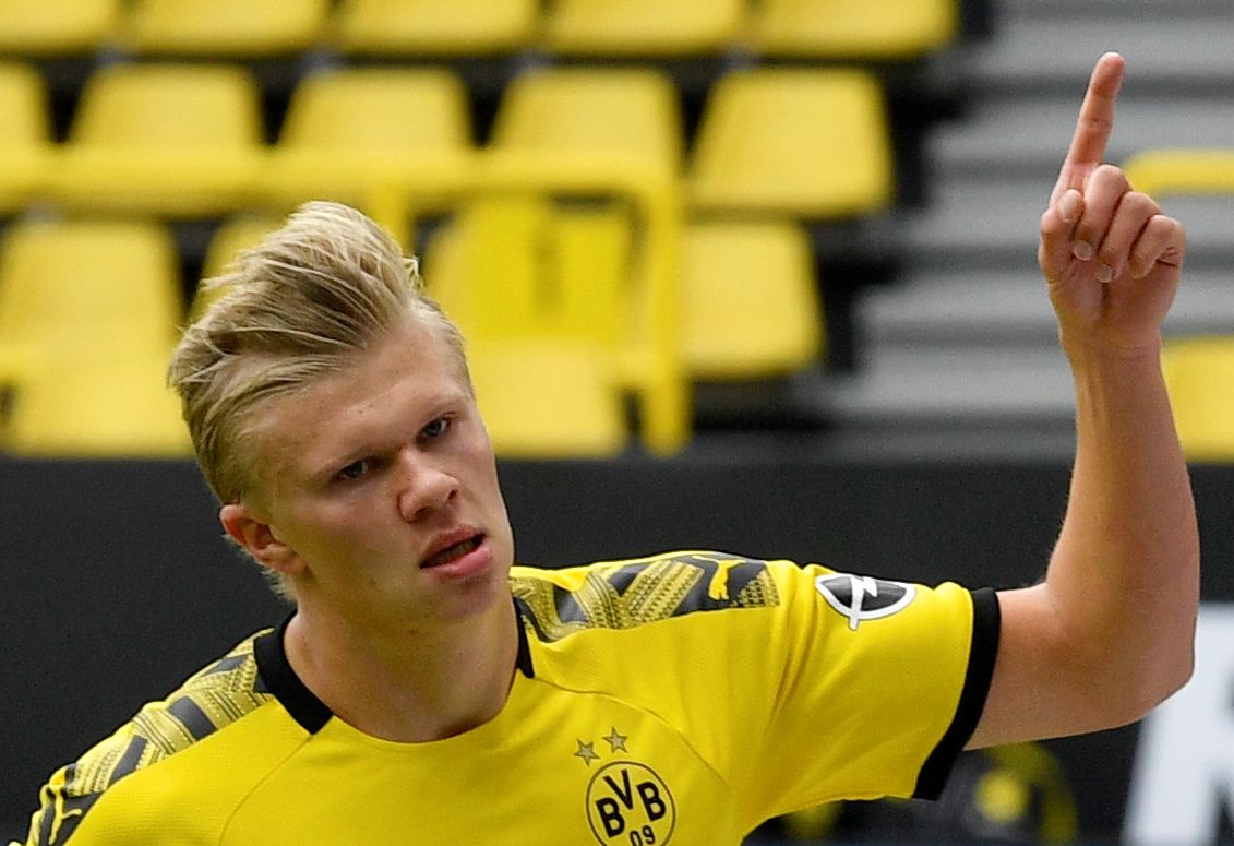 Soccer Football - Bundesliga - Borussia Dortmund v Schalke 04 - Signal Iduna Park, Dortmund, Germany - May 16, 2020 Dortmund's Erling Braut Haaland celebrates scoring their first goal as play resumes behind closed doors following the outbreak of the coronavirus disease (COVID-19) Martin Meissner/Pool via REUTERS  DFL regulations prohibit any use of photographs as image sequences and/or quasi-video