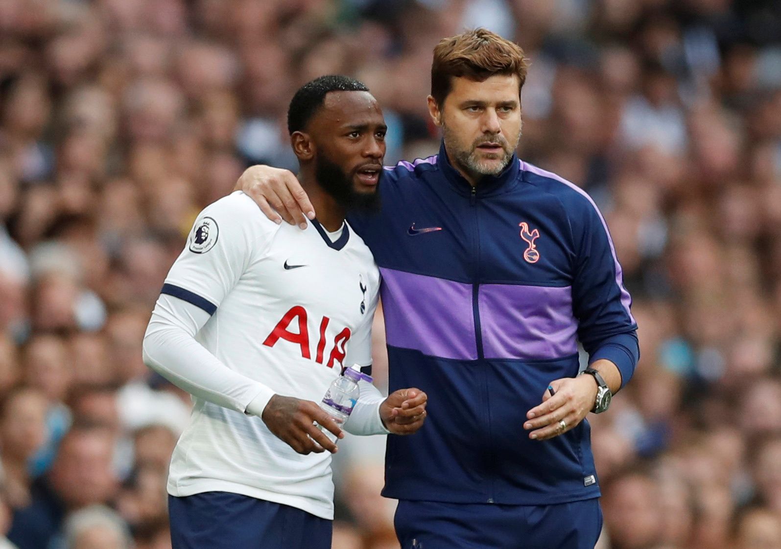 Soccer Football - Premier League - Tottenham Hotspur v Aston Villa - Tottenham Hotspur Stadium, London, Britain - August 10, 2019  Tottenham Hotspur manager Mauricio Pochettino with substitute Georges-Kevin Nkoudou   Action Images via Reuters/Matthew Childs  EDITORIAL USE ONLY. No use with unauthorized audio, video, data, fixture lists, club/league logos or 