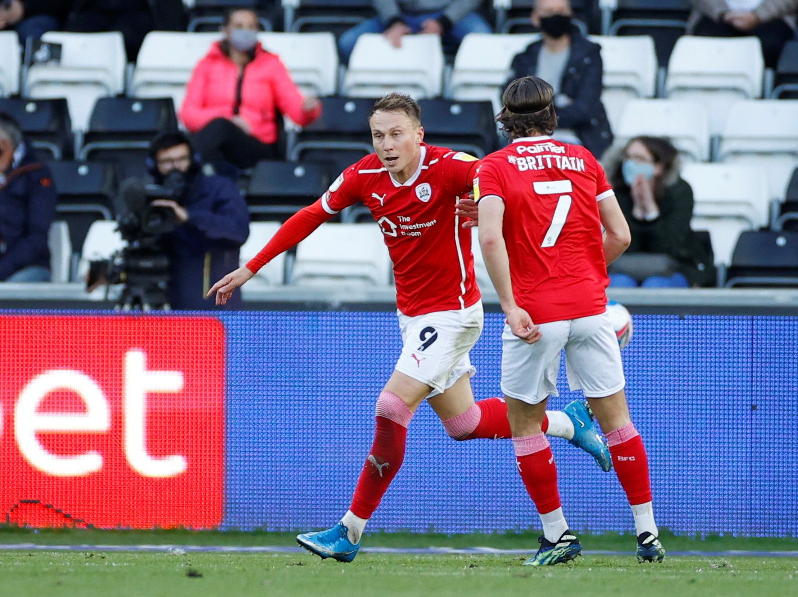 Soccer Football - Championship Play-Off Semi Final Second Leg - Swansea City v Barnsley - Liberty Stadium, Swansea, Britain - May 22, 2021  Barnsley's Cauley Woodrow celebrates scoring their first goal with Callum Brittain Action Images via Reuters/John Sibley    EDITORIAL USE ONLY. No use with unauthorized audio, video, data, fixture lists, club/league logos or "live" services. Online in-match use limited to 75 images, no video emulation. No use in betting, games or single club/league/player pu