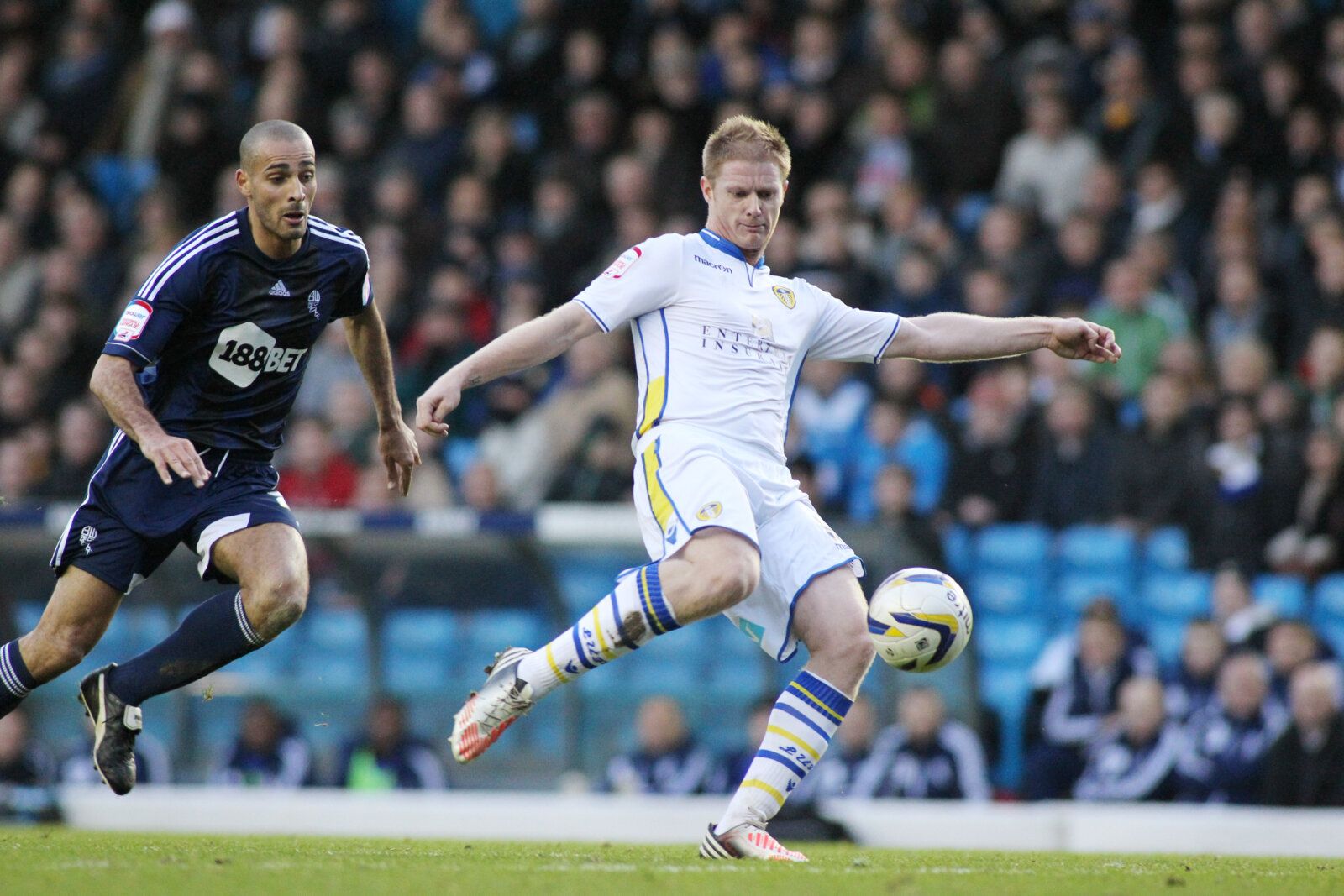 Football - Leeds United v Bolton Wanderers - npower Football League Championship - Elland Road - 12/13 , 1/1/13 
Alan Tate  - Leeds United in action against Darren Pratley - Bolton Wanderers 
Mandatory Credit: Action Images / Ed Sykes 
EDITORIAL USE ONLY. No use with unauthorized audio, video, data, fixture lists, club/league logos or live services. Online in-match use limited to 45 images, no video emulation. No use in betting, games or single club/league/player publications.  Please contact yo