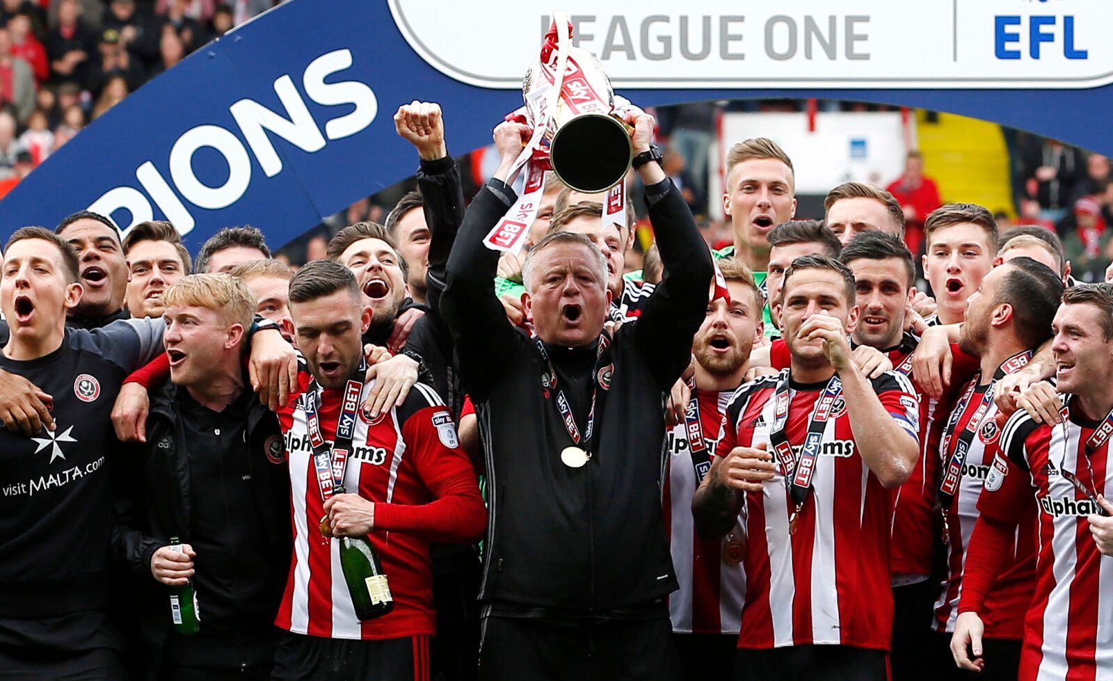 Britain Football Soccer - Sheffield United v Chesterfield - Sky Bet League One - Bramall Lane - 30/4/17 Sheffield United Manager Chris Wilder and players celebrate winning the league with the trophy  Mandatory Credit: Action Images / Craig Brough Livepic EDITORIAL USE ONLY. No use with unauthorized audio, video, data, fixture lists, club/league logos or 