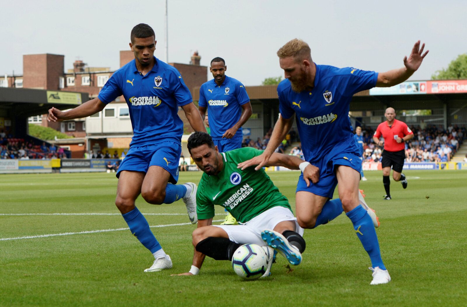 Soccer Football - Pre Season Friendly - AFC Wimbledon v Brighton &amp; Hove Albion - The Cherry Red Records Stadium, London, Britain - July 21, 2018   Brighton's Beram Kayal in action with AFC Wimbledon's Tennai Watson and Scott Wagstaff   Action Images via Reuters/Adam Holt