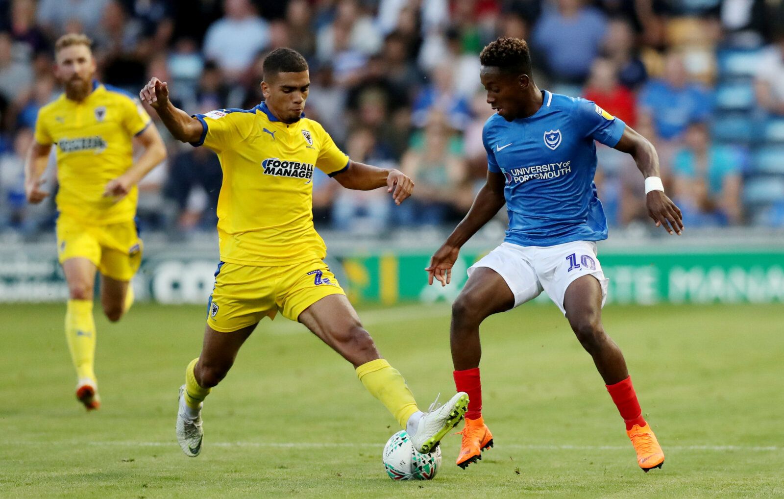 Soccer Football - Carabao Cup First Round - Portsmouth v AFC Wimbledon - Fratton Park, Portsmouth, Britain - August 14, 2018   Portsmouth's Jamal Lowe in action with AFC Wimbledon's Tennai Watson   Action Images/Peter Cziborra    EDITORIAL USE ONLY. No use with unauthorized audio, video, data, fixture lists, club/league logos or 
