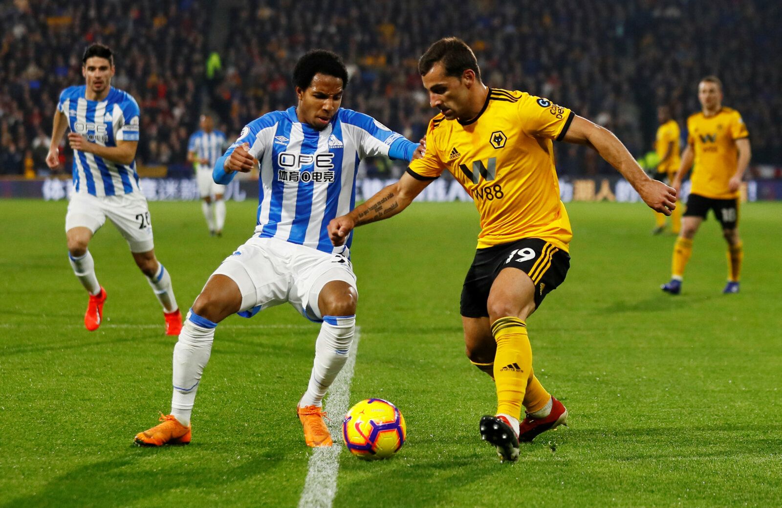 Soccer Football - Premier League - Huddersfield Town v Wolverhampton Wanderers - John Smith's Stadium, Huddersfield, Britain - February 26, 2019  Huddersfield Town's Demeaco Duhaney in action with Wolverhampton Wanderers' Jonny Castro          Action Images via Reuters/Jason Cairnduff  EDITORIAL USE ONLY. No use with unauthorized audio, video, data, fixture lists, club/league logos or 