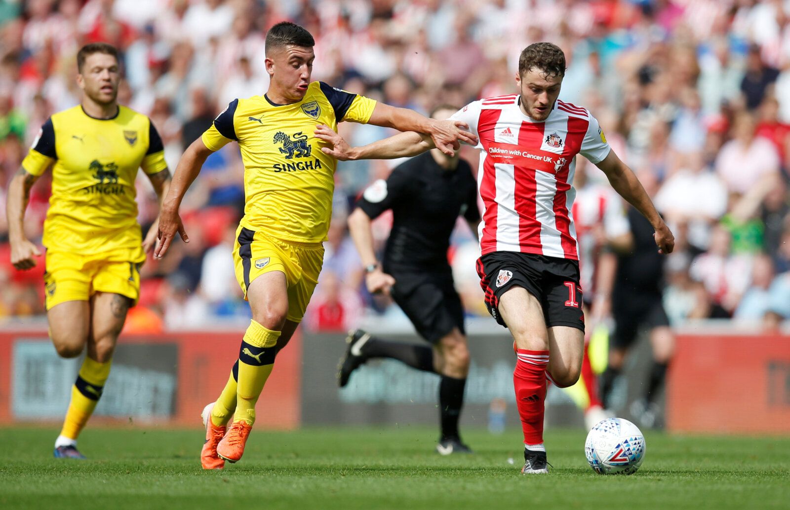 Soccer Football - League One - Sunderland v Oxford United - Stadium of Light, Sunderland, Britain - August 3, 2019  Oxford United's Cameron Brannagan in action with Sunderland's Elliot Embleton  Action Images/Ed Sykes  EDITORIAL USE ONLY. No use with unauthorized audio, video, data, fixture lists, club/league logos or 