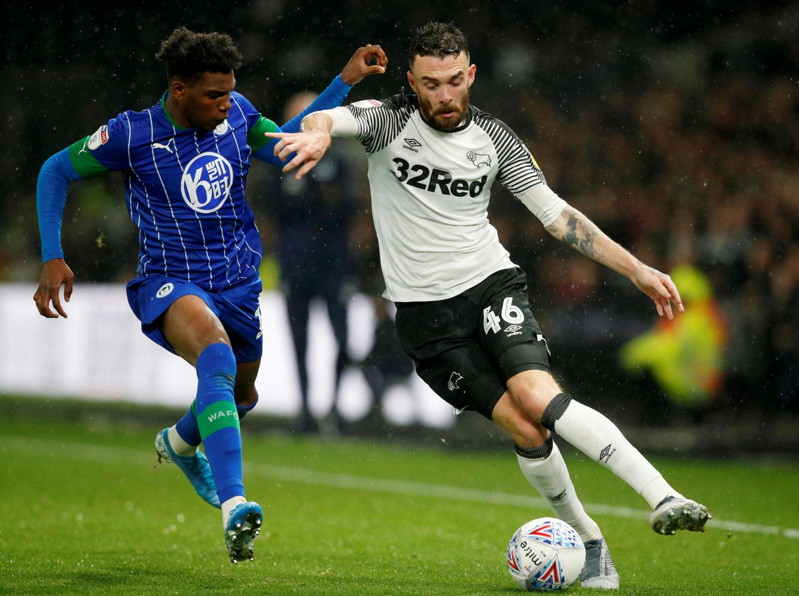 Soccer Football - Championship - Derby County v Wigan Athletic - Pride Park, Derby, Britain - October 23, 2019  Wigan Athletic's Dujon Sterling and Derby County's Scott Malone in action  Action Images/Ed Sykes  EDITORIAL USE ONLY. No use with unauthorized audio, video, data, fixture lists, club/league logos or 