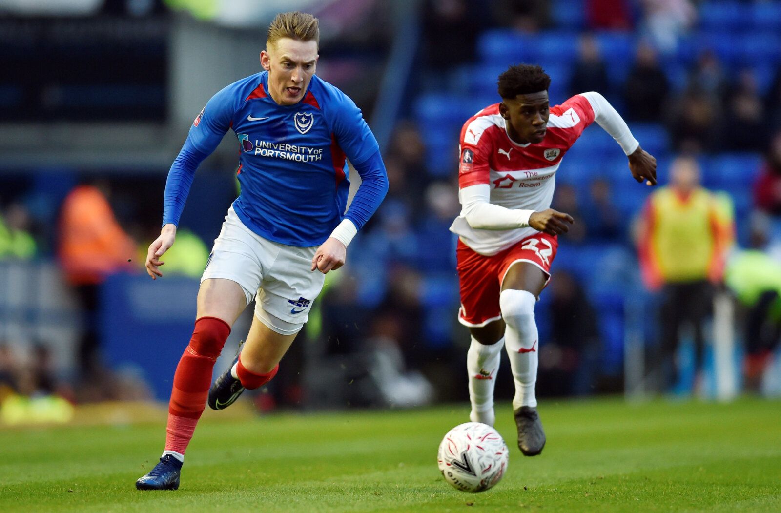 Soccer Football - FA Cup Fourth Round - Portsmouth v Barnsley - Fratton Park, Portsmouth, Britain - January 25, 2020  Portsmouth's Ronan Curtis in action with Barnsley's Clarke Oduor   Action Images/Adam Holt
