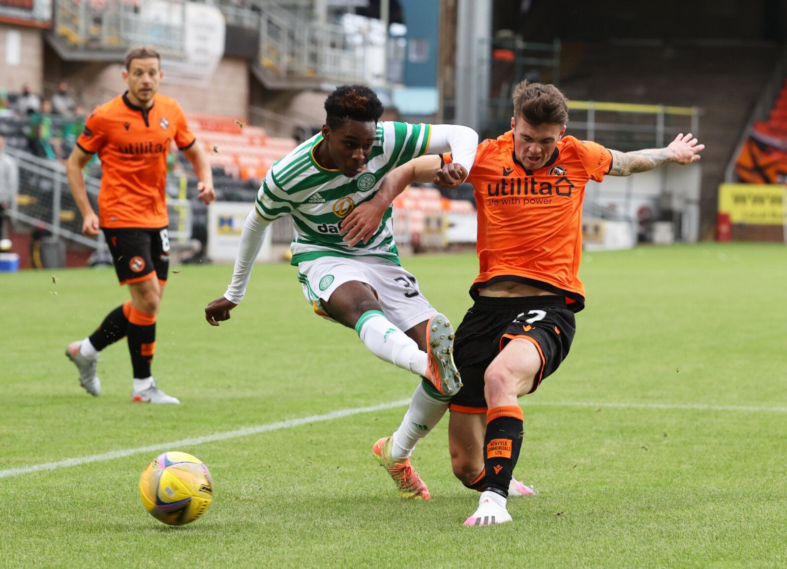 Soccer Football - Scottish Premiership - Dundee United v Celtic - Tannadice Park, Dundee, Scotland, Britain - August 22, 2020 Celtic's Jeremie Frimpong in action with Dundee United's Jamie Robson, as play resumes behind closed doors following the outbreak of the coronavirus disease (COVID-19) Pool via REUTERS/Steve Welsh