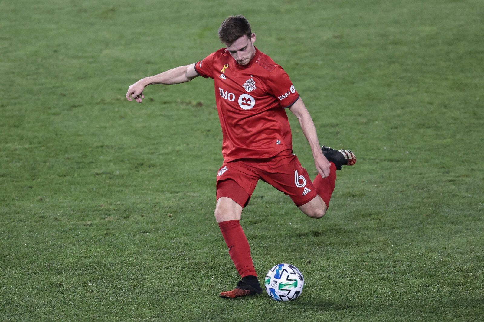 Sep 23, 2020; Harrison, New Jersey, USA; Toronto FC defender Tony Gallacher (6) kicks the ball during the first half against New York City FC at Red Bull Arena. Mandatory Credit: Vincent Carchietta-USA TODAY Sports