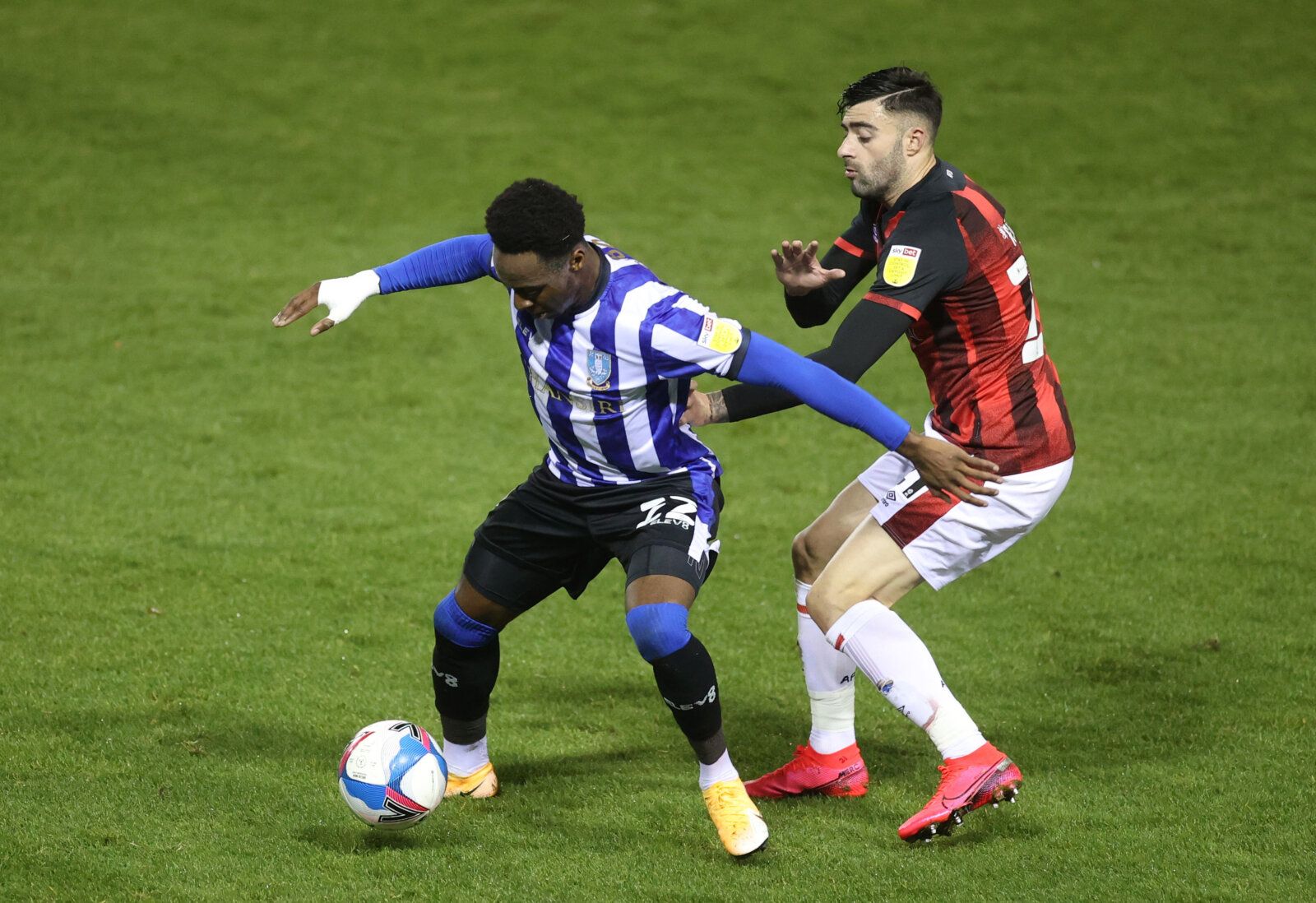 Soccer Football - Championship - Sheffield Wednesday v AFC Bournemouth - Hillsborough, Sheffield, Britain - November 3, 2020 Sheffield Wednesday's Moses Odubajo in action with Bournemouth's Diego Rico Action Images/Carl Recine EDITORIAL USE ONLY. No use with unauthorized audio, video, data, fixture lists, club/league logos or 'live' services. Online in-match use limited to 75 images, no video emulation. No use in betting, games or single club /league/player publications.  Please contact your acc