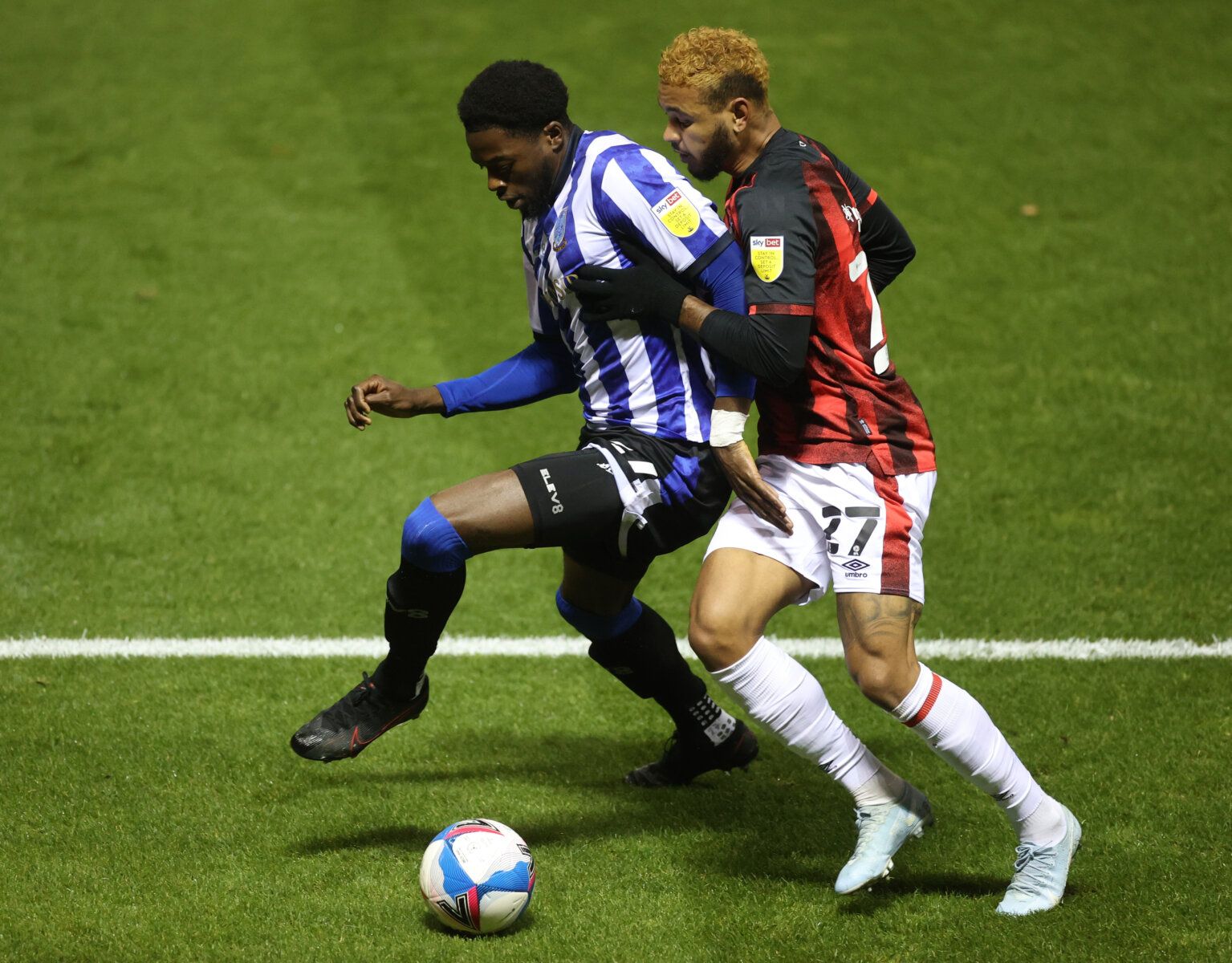 Soccer Football - Championship - Sheffield Wednesday v AFC Bournemouth - Hillsborough, Sheffield, Britain - November 3, 2020 Sheffield Wednesday's Dominic Iorfa in action with Bournemouth's Joshua King Action Images/Carl Recine EDITORIAL USE ONLY. No use with unauthorized audio, video, data, fixture lists, club/league logos or 'live' services. Online in-match use limited to 75 images, no video emulation. No use in betting, games or single club /league/player publications.  Please contact your ac
