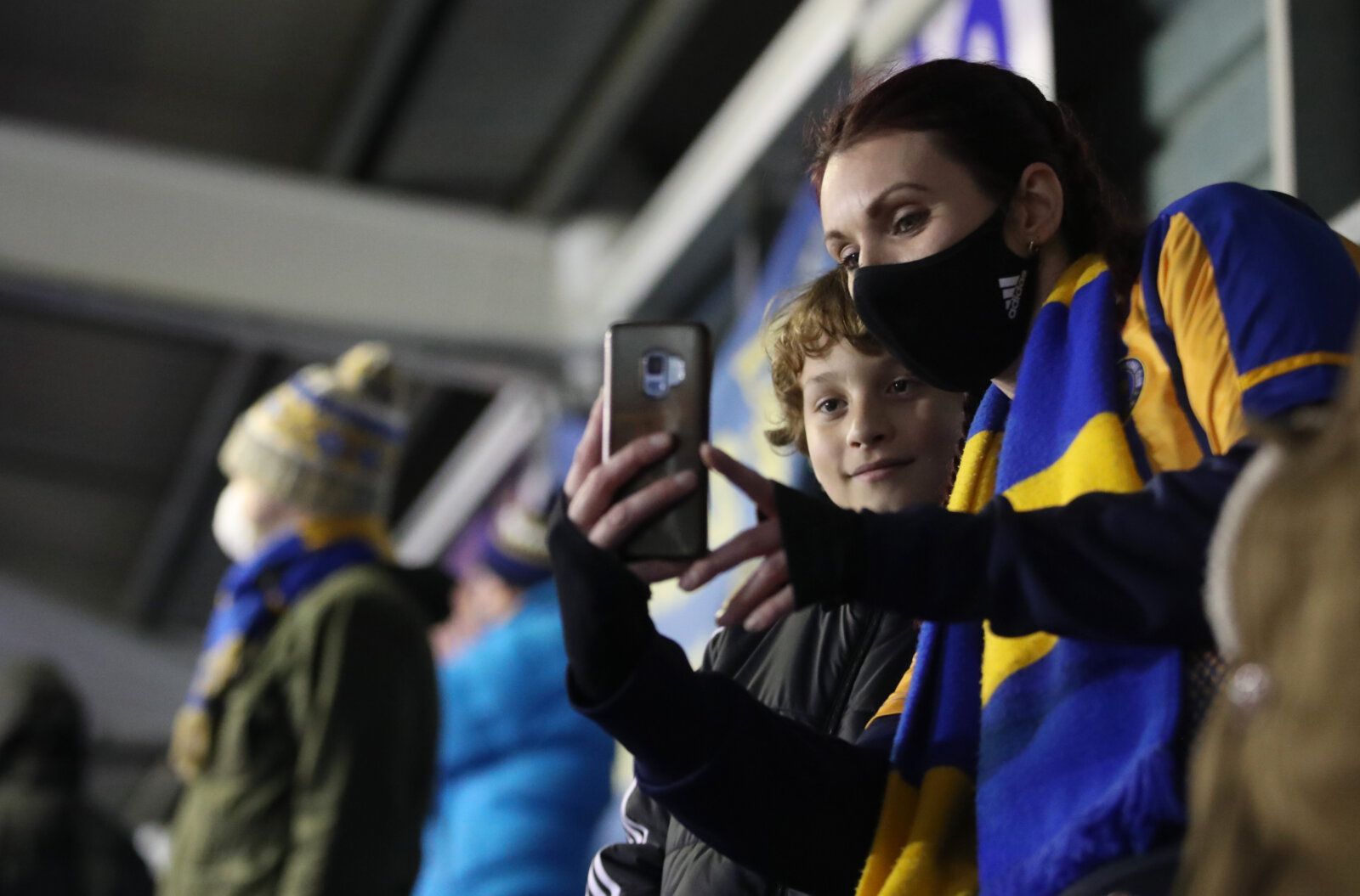Soccer Football - League One - Shrewsbury Town v Accrington Stanley - New Meadow, Shrewsbury, Britain - December 2, 2020 Fans in the stands pose for a picture, as a limited number of fans are allowed to attend stadiums following the outbreak of the coronavirus disease (COVID-19) Action Images via Reuters/Carl Recine EDITORIAL USE ONLY. No use with unauthorized audio, video, data, fixture lists, club/league logos or 'live' services. Online in-match use limited to 75 images, no video emulation. No