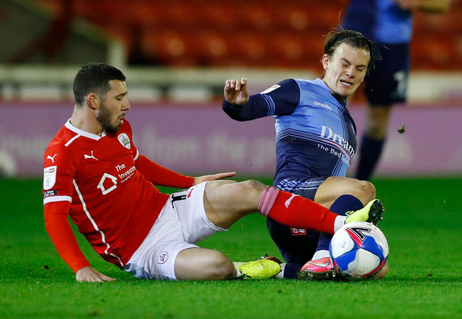 Soccer Football - Championship - Barnsley v Wycombe Wanderers - Oakwell, Barnsley, Britain - December 9, 2020 Barnsley's Conor Chaplin in action with Wycombe Wanderers' Dominic Gape Action Images/Jason Cairnduff EDITORIAL USE ONLY. No use with unauthorized audio, video, data, fixture lists, club/league logos or 'live' services. Online in-match use limited to 75 images, no video emulation. No use in betting, games or single club /league/player publications.  Please contact your account representa