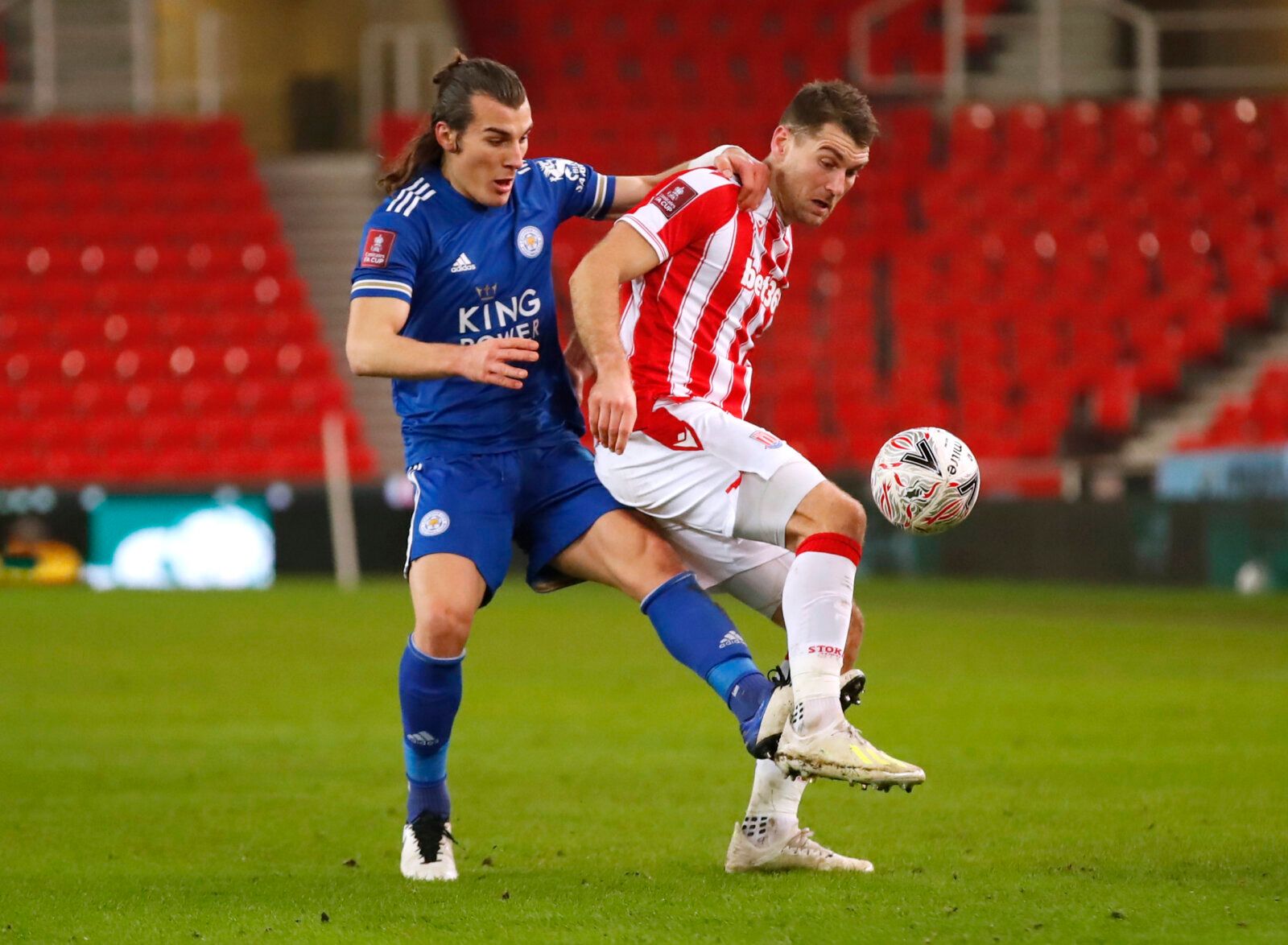 Soccer Football - FA Cup - Third Round - Stoke City v Leicester City - bet365 Stadium, Stoke-On-Trent, Britain - January 9, 2021 Leicester City's Caglar Soyuncu in action with Stoke City's Sam Vokes Action Images via Reuters/Andrew Boyers