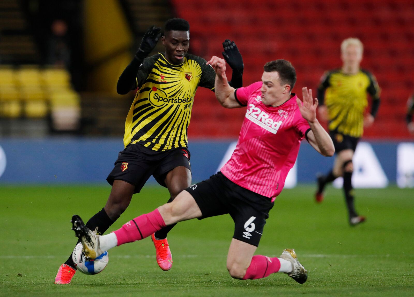 Soccer Football - Championship -  Watford v Derby County - Vicarage Road, Watford, Britain - February 19, 2021 Watford’s Ismaila Sarr in action with Derby County's George Edmundson Action Images/Andrew Couldridge EDITORIAL USE ONLY. No use with unauthorized audio, video, data, fixture lists, club/league logos or 'live' services. Online in-match use limited to 75 images, no video emulation. No use in betting, games or single club /league/player publications.  Please contact your account represent