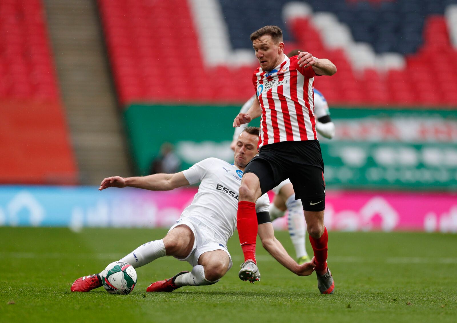 Soccer Football - EFL Trophy Final - Sunderland v Tranmere Rovers - Wembley Stadium, London, Britain - March 14, 2021 Sunderland's Charlie Wyke in action with Tranmere's George Ray Action Images/Lee Smith EDITORIAL USE ONLY. No use with unauthorized audio, video, data, fixture lists, club/league logos or 'live' services. Online in-match use limited to 75 images, no video emulation. No use in betting, games or single club /league/player publications.  Please contact your account representative fo