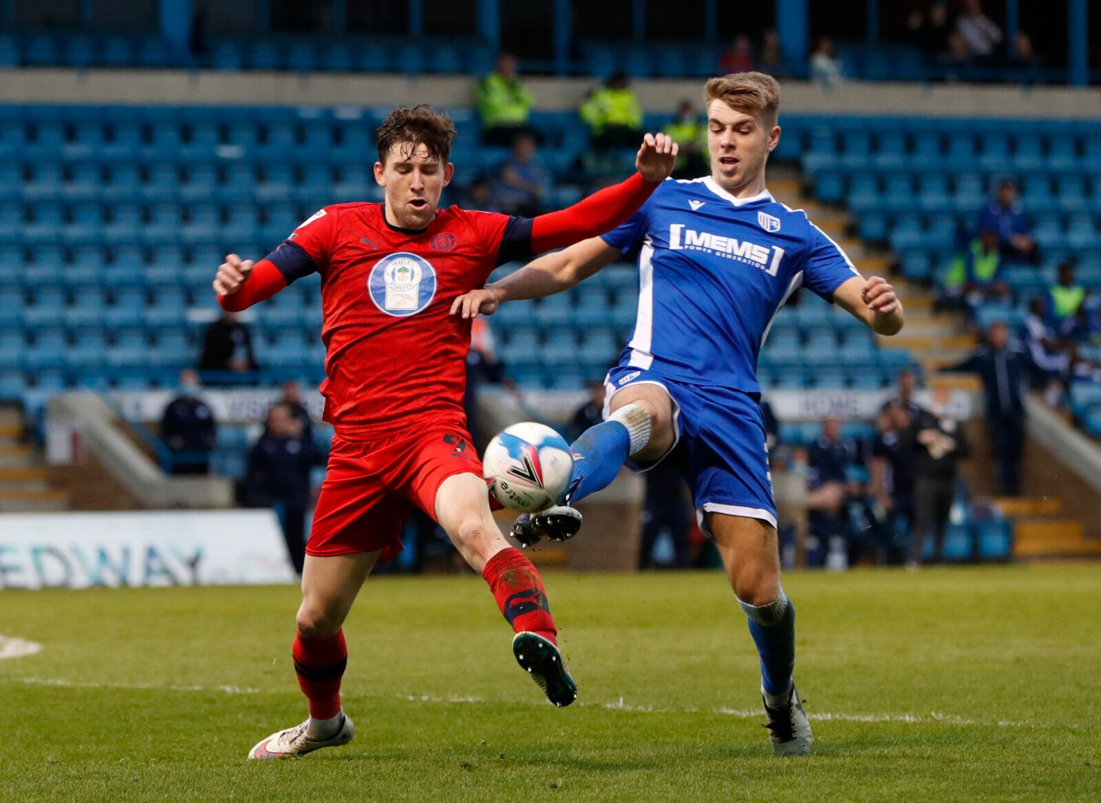 Soccer Football - League One - Gillingham v Wigan Athletic - Priestfield Stadium, Gillingham, Britain - March 31, 2021 Gillingham's Jack Tucker in action with Wigan Athletic's Callum Lang Action Images/Paul Childs EDITORIAL USE ONLY. No use with unauthorized audio, video, data, fixture lists, club/league logos or 'live' services. Online in-match use limited to 75 images, no video emulation. No use in betting, games or single club /league/player publications.  Please contact your account represen