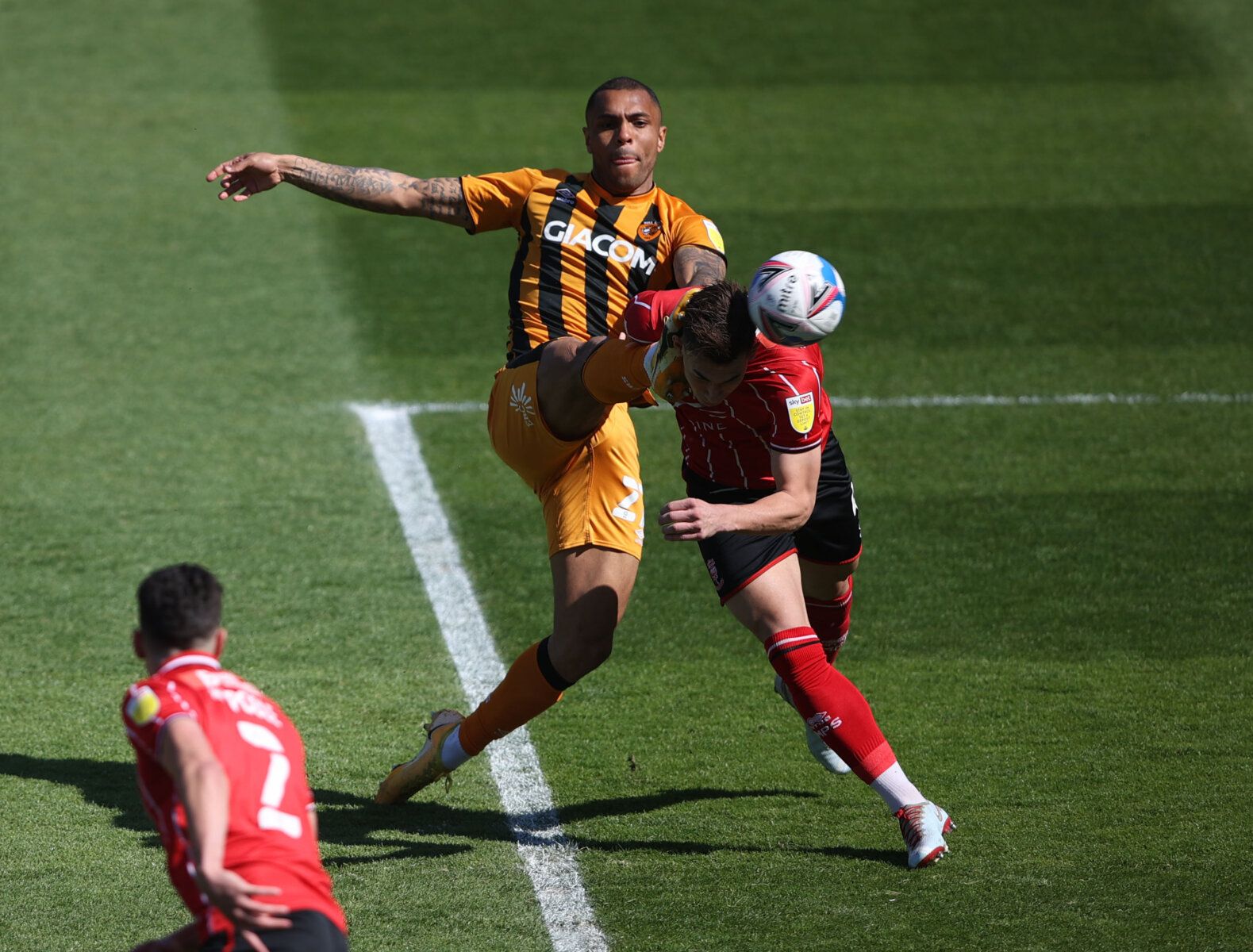 Soccer Football - League One - Lincoln City v Hull City - Sincil Bank, Lincoln, Britain - April 24, 2021 Hull City's Josh Magennis scores their first goal Action Images/Molly Darlington EDITORIAL USE ONLY. No use with unauthorized audio, video, data, fixture lists, club/league logos or 'live' services. Online in-match use limited to 75 images, no video emulation. No use in betting, games or single club /league/player publications.  Please contact your account representative for further details.