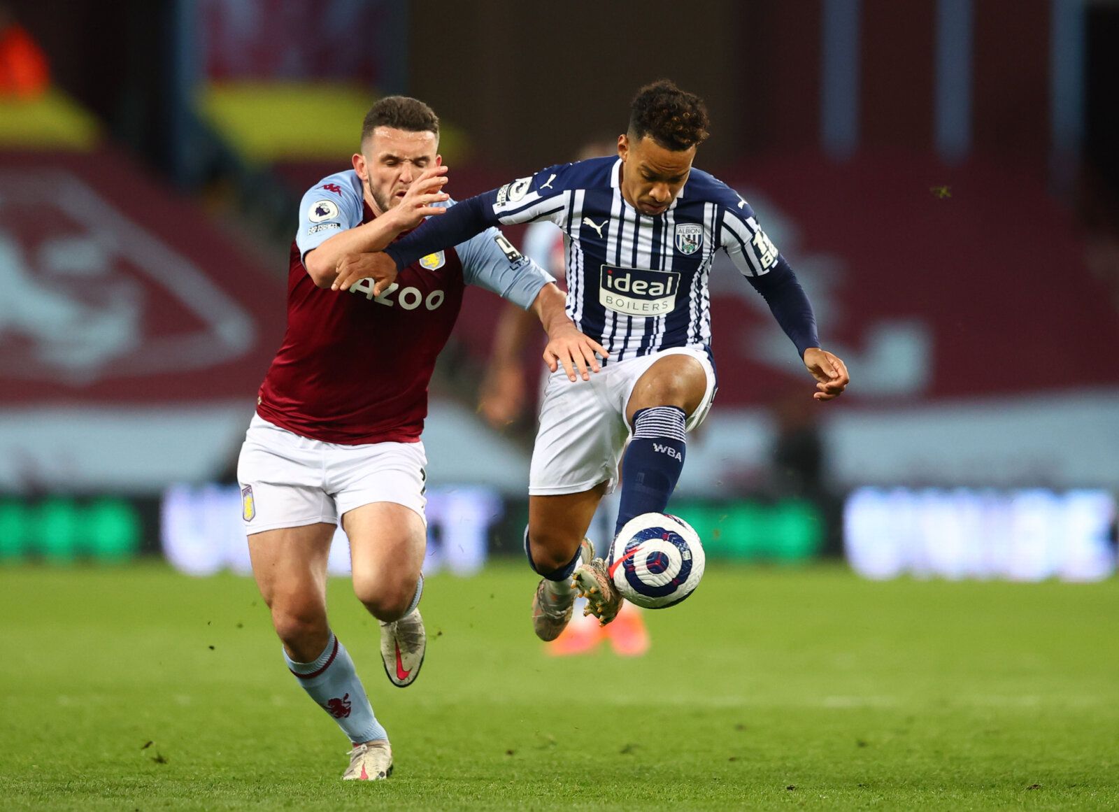 Soccer Football - Premier League - Aston Villa v West Bromwich Albion  - Villa Park, Birmingham, Britain - April 25, 2021 West Bromwich Albion's Matheus Pereira in action with Aston Villa's John McGinn Pool via REUTERS/Michael Steele EDITORIAL USE ONLY. No use with unauthorized audio, video, data, fixture lists, club/league logos or 'live' services. Online in-match use limited to 75 images, no video emulation. No use in betting, games or single club /league/player publications.  Please contact y
