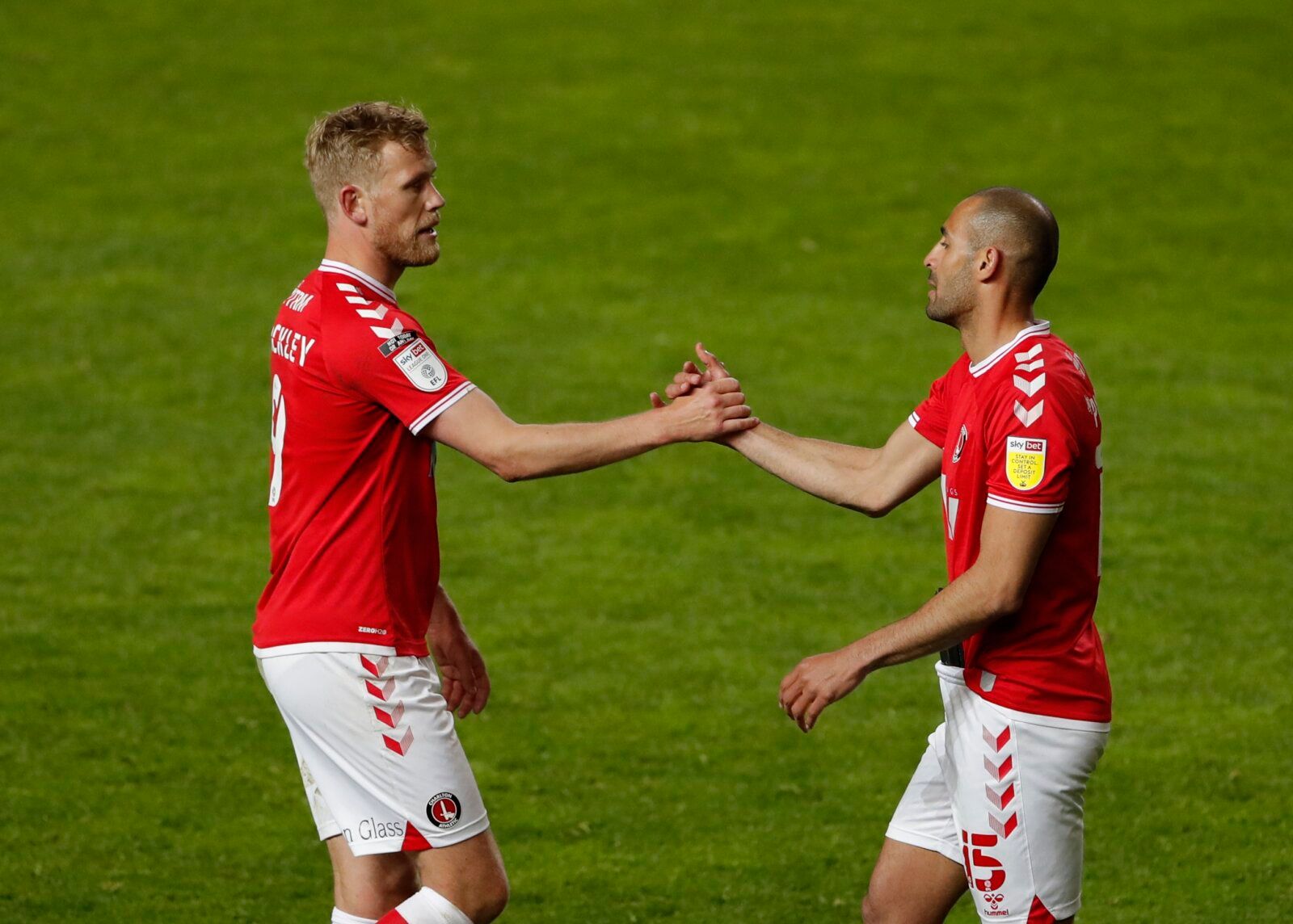 Soccer Football - League One - Charlton Athletic v Lincoln City - The Valley, London, Britain - May 4, 2021 Charlton Athletic's Jayden Stockley and Darren Pratley celebrate after the match Action Images/Andrew Couldridge EDITORIAL USE ONLY. No use with unauthorized audio, video, data, fixture lists, club/league logos or 'live' services. Online in-match use limited to 75 images, no video emulation. No use in betting, games or single club /league/player publications.  Please contact your account r