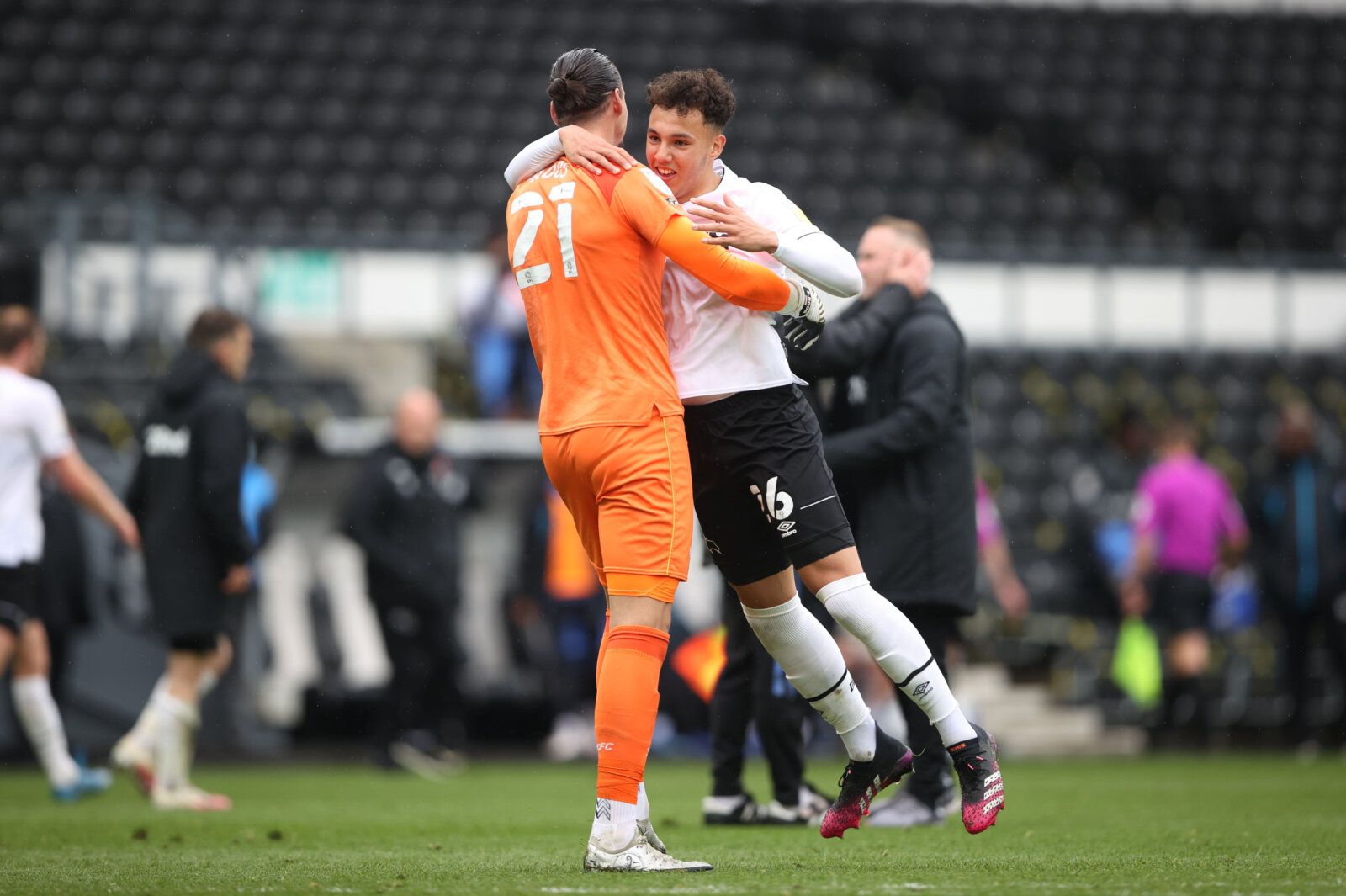 Soccer Football - Championship - Derby County v Sheffield Wednesday - Pride Park, Derby, Britain - May 8, 2021 Derby County's Lee Buchanan and Kelle Roos celebrate after the match Action Images/Molly Darlington EDITORIAL USE ONLY. No use with unauthorized audio, video, data, fixture lists, club/league logos or 'live' services. Online in-match use limited to 75 images, no video emulation. No use in betting, games or single club /league/player publications.  Please contact your account representat
