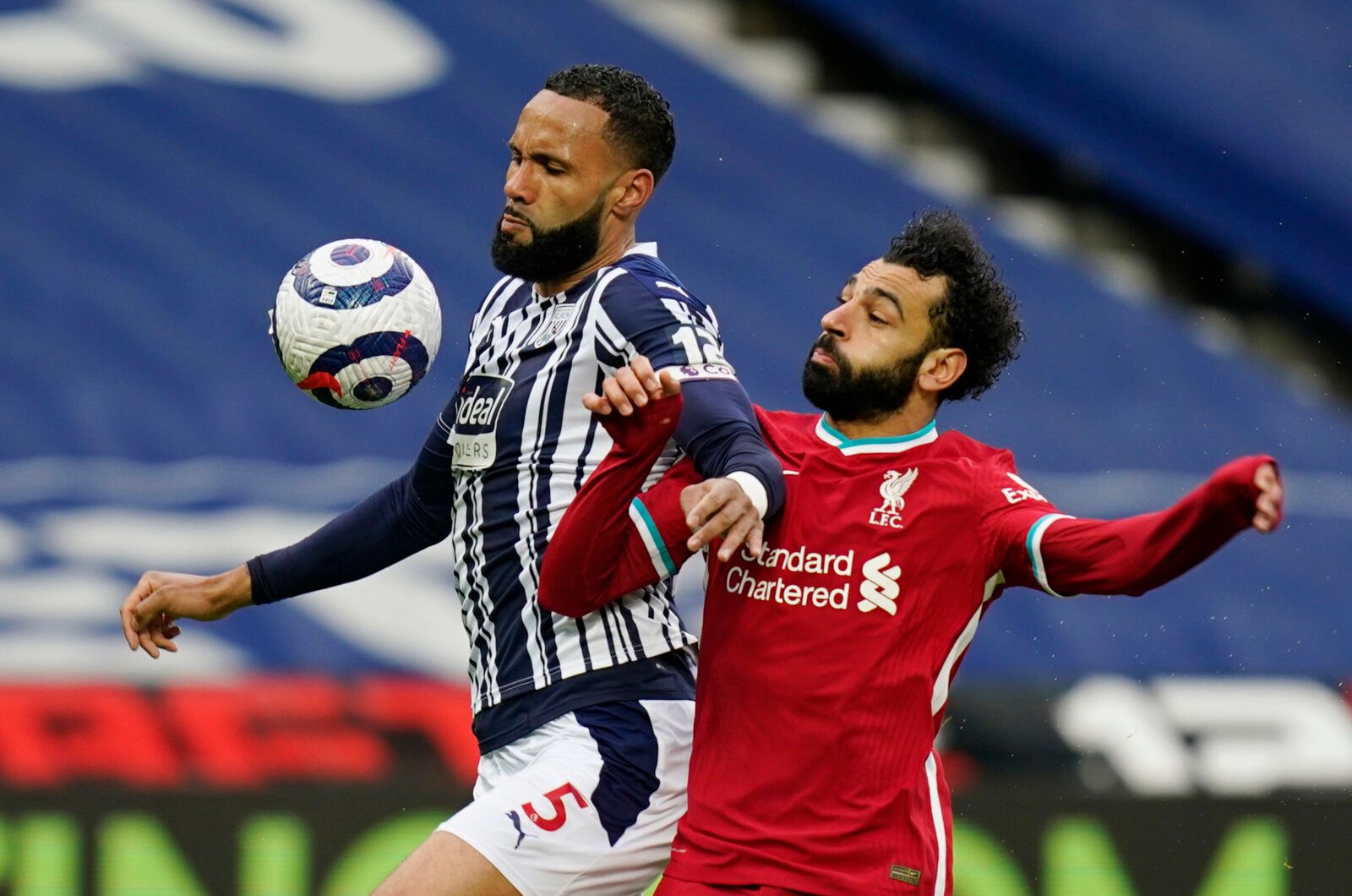 Soccer Football - Premier League - West Bromwich Albion v Liverpool - The Hawthorns, West Bromwich, Britain - May 16, 2021 West Bromwich Albion's Kyle Bartley in action with Liverpool's Mohamed Salah Pool via REUTERS/Tim Keeton EDITORIAL USE ONLY. No use with unauthorized audio, video, data, fixture lists, club/league logos or 'live' services. Online in-match use limited to 75 images, no video emulation. No use in betting, games or single club /league/player publications.  Please contact your ac