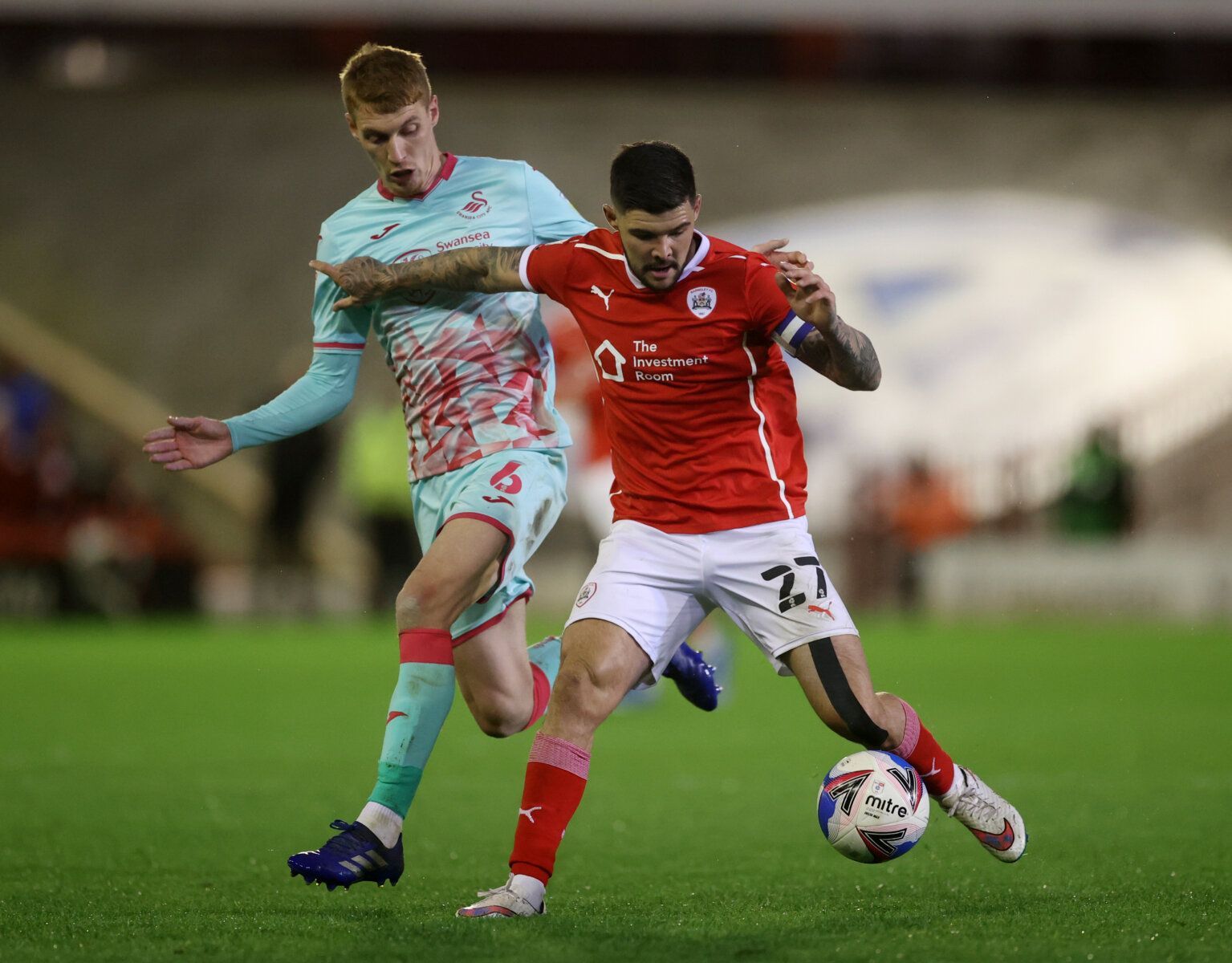 Soccer Football - Championship - Play-Off Semi Final First Leg - Barnsley v Swansea City - Oakwell, Barnsley, Britain - May 17, 2021 Swansea City's Jay Fulton in action with Barnsley's Alex Mowatt Action Images via Reuters/Carl Recine EDITORIAL USE ONLY. No use with unauthorized audio, video, data, fixture lists, club/league logos or 'live' services. Online in-match use limited to 75 images, no video emulation. No use in betting, games or single club /league/player publications. Please contact 