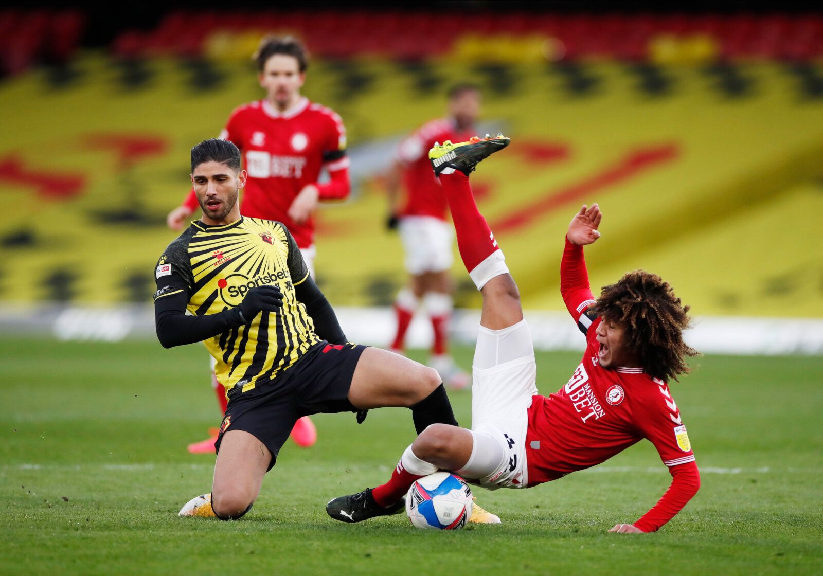 Soccer Football - Championship - Watford v Bristol City - Vicarage Road, Watford, Britain - February 13, 2021 Watford's Achraf Lazaar and Bristol City's Han-Noah Massengo Action Images/Paul Childs EDITORIAL USE ONLY. No use with unauthorized audio, video, data, fixture lists, club/league logos or 'live' services. Online in-match use limited to 75 images, no video emulation. No use in betting, games or single club /league/player publications.  Please contact your account representative for furthe