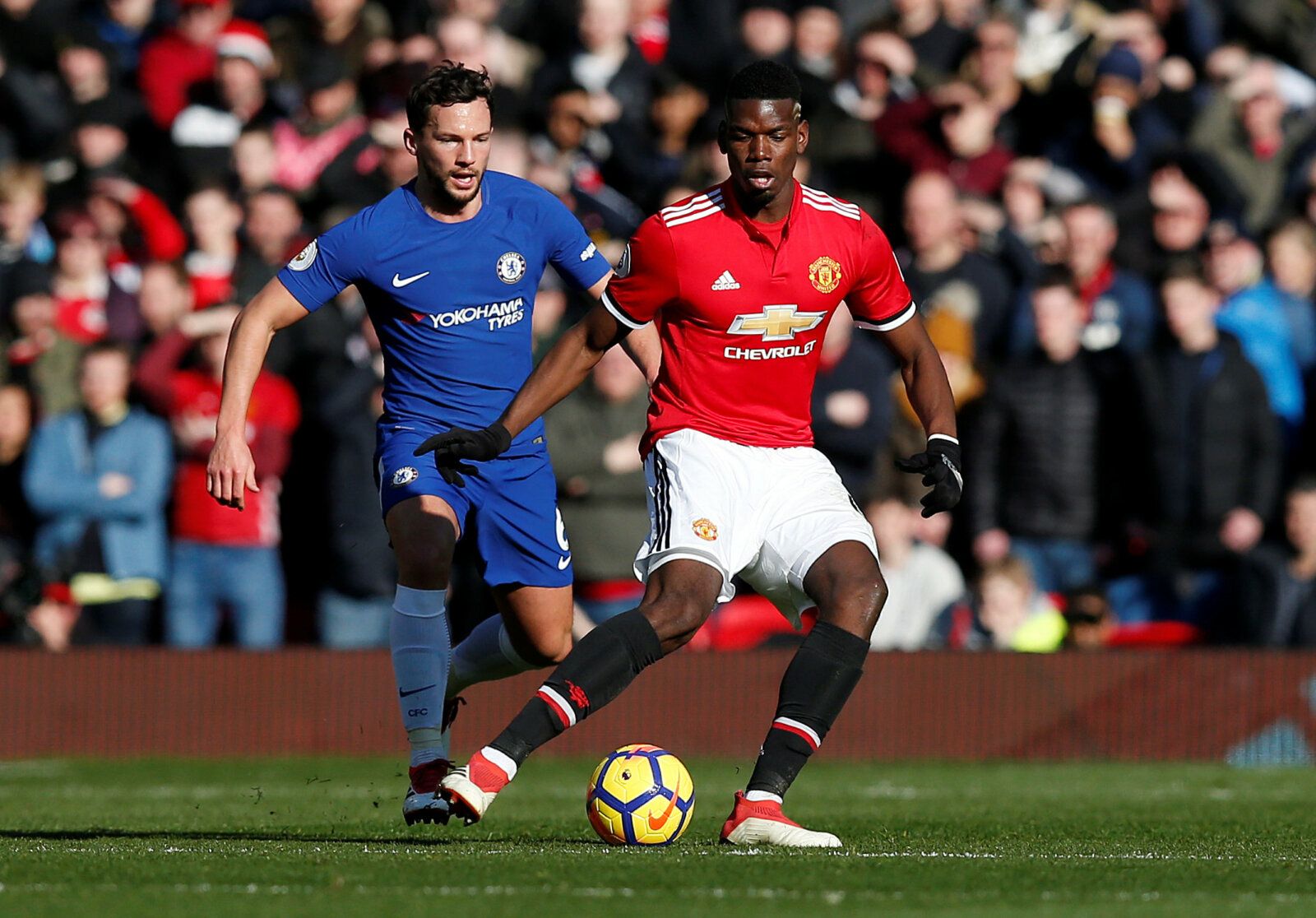 Soccer Football - Premier League - Manchester United vs Chelsea - Old Trafford, Manchester, Britain - February 25, 2018   Manchester United's Paul Pogba in action with Chelsea’s Danny Drinkwater    REUTERS/Andrew Yates    EDITORIAL USE ONLY. No use with unauthorized audio, video, data, fixture lists, club/league logos or 