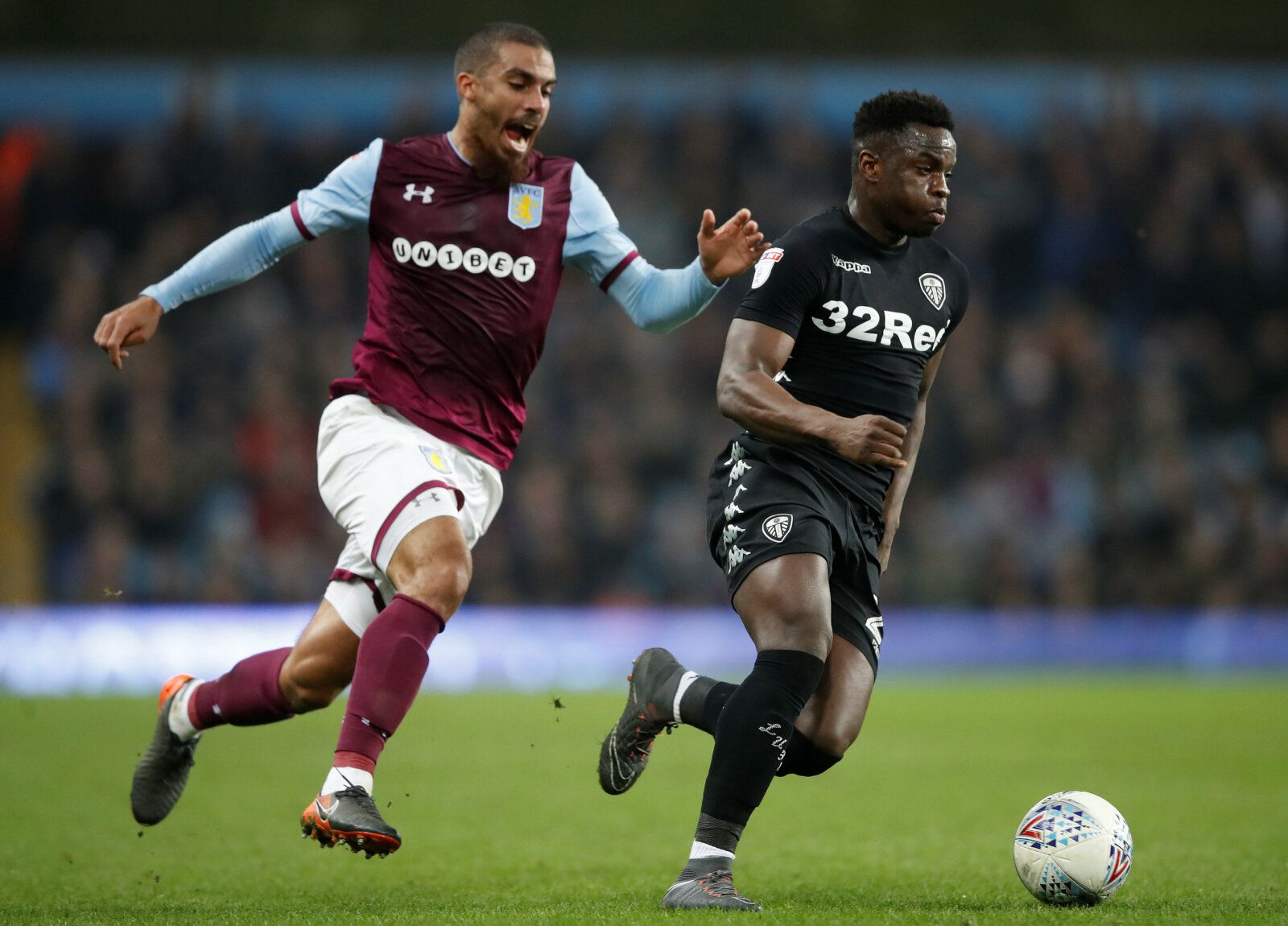 Soccer Football - Championship - Aston Villa vs Leeds United - Villa Park, Birmingham, Britain - April 13, 2018   Aston Villa's Lewis Grabban in action with Leeds United's Ronaldo Vieira   Action Images/Carl Recine    EDITORIAL USE ONLY. No use with unauthorized audio, video, data, fixture lists, club/league logos or 