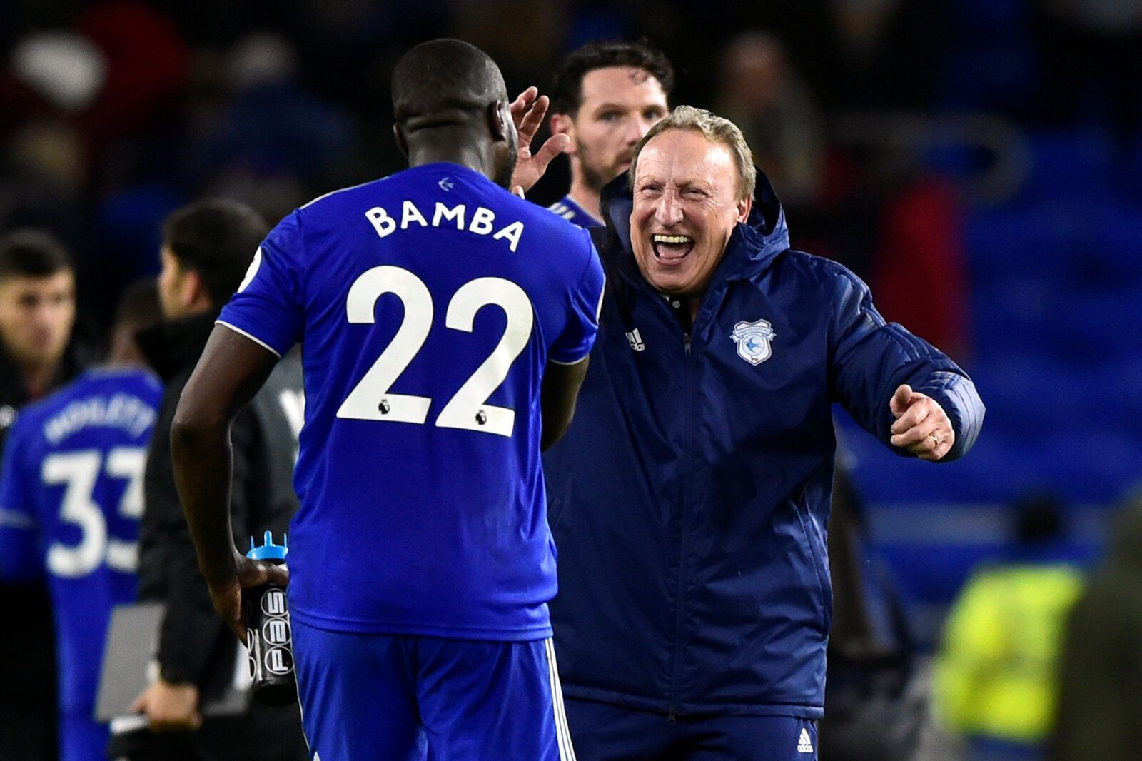 Soccer Football - Premier League - Cardiff City v Wolverhampton Wanderers - Cardiff City Stadium, Cardiff, Britain - November 30, 2018   Cardiff City manager Neil Warnock celebrates with Sol Bamba at the end of the match    REUTERS/Rebecca Naden    EDITORIAL USE ONLY. No use with unauthorized audio, video, data, fixture lists, club/league logos or 
