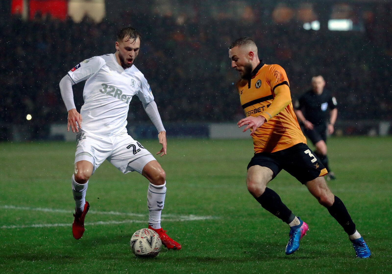 Soccer Football - FA Cup Fourth Round Replay - Newport County v Middlesbrough - Rodney Parade, Newport, Britain - February 5, 2019   Middlesbrough's Lewis Wing in action with Newport County's Dan Butler   Action Images/Andrew Couldridge