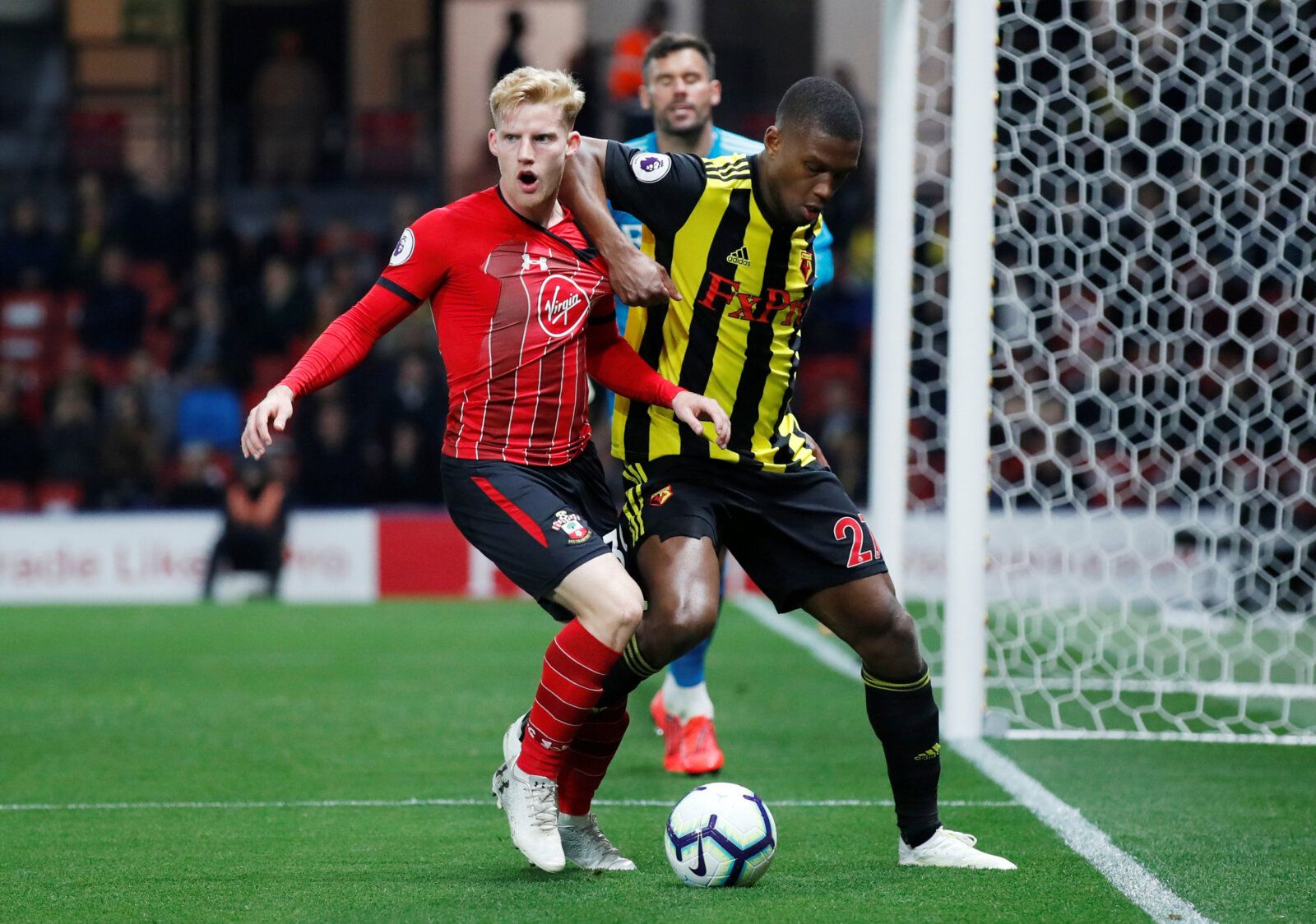 Soccer Football - Premier League - Watford v Southampton - Vicarage Road, Watford, Britain - April 23, 2019  Southampton's Josh Sims in action with Watford's Christian Kabasele              REUTERS/David Klein  EDITORIAL USE ONLY. No use with unauthorized audio, video, data, fixture lists, club/league logos or "live" services. Online in-match use limited to 75 images, no video emulation. No use in betting, games or single club/league/player publications.  Please contact your account representati