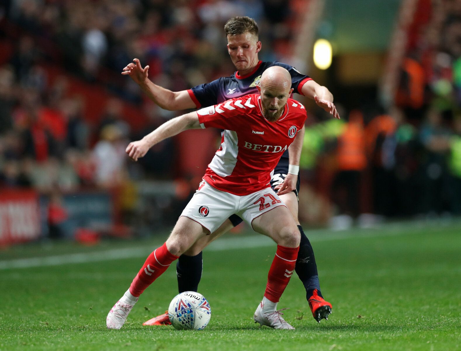 Soccer Football - League One Play-Off Semi Final Second Leg - Charlton Athletic v Doncaster Rovers - The Valley, London, Britain - May 17, 2019   Charlton's Jonny Williams in action with Doncaster's Paul Downing   Action Images/Paul Childs    EDITORIAL USE ONLY. No use with unauthorized audio, video, data, fixture lists, club/league logos or "live" services. Online in-match use limited to 75 images, no video emulation. No use in betting, games or single club/league/player publications.  Please c