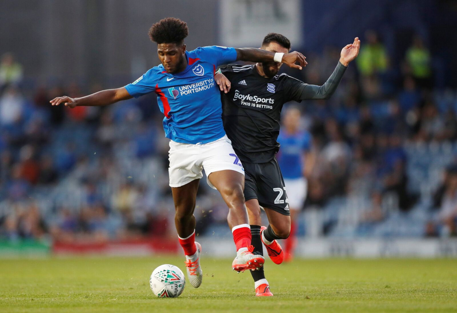 Soccer Football - Carabao Cup First Round - Portsmouth v Birmingham City - Fratton Park, Portsmouth, Britain - August 6, 2019   Portsmouth's Ellis Harrison in action with Birmingham City's Agustin Medina      Action Images/Matthew Childs    EDITORIAL USE ONLY. No use with unauthorized audio, video, data, fixture lists, club/league logos or 