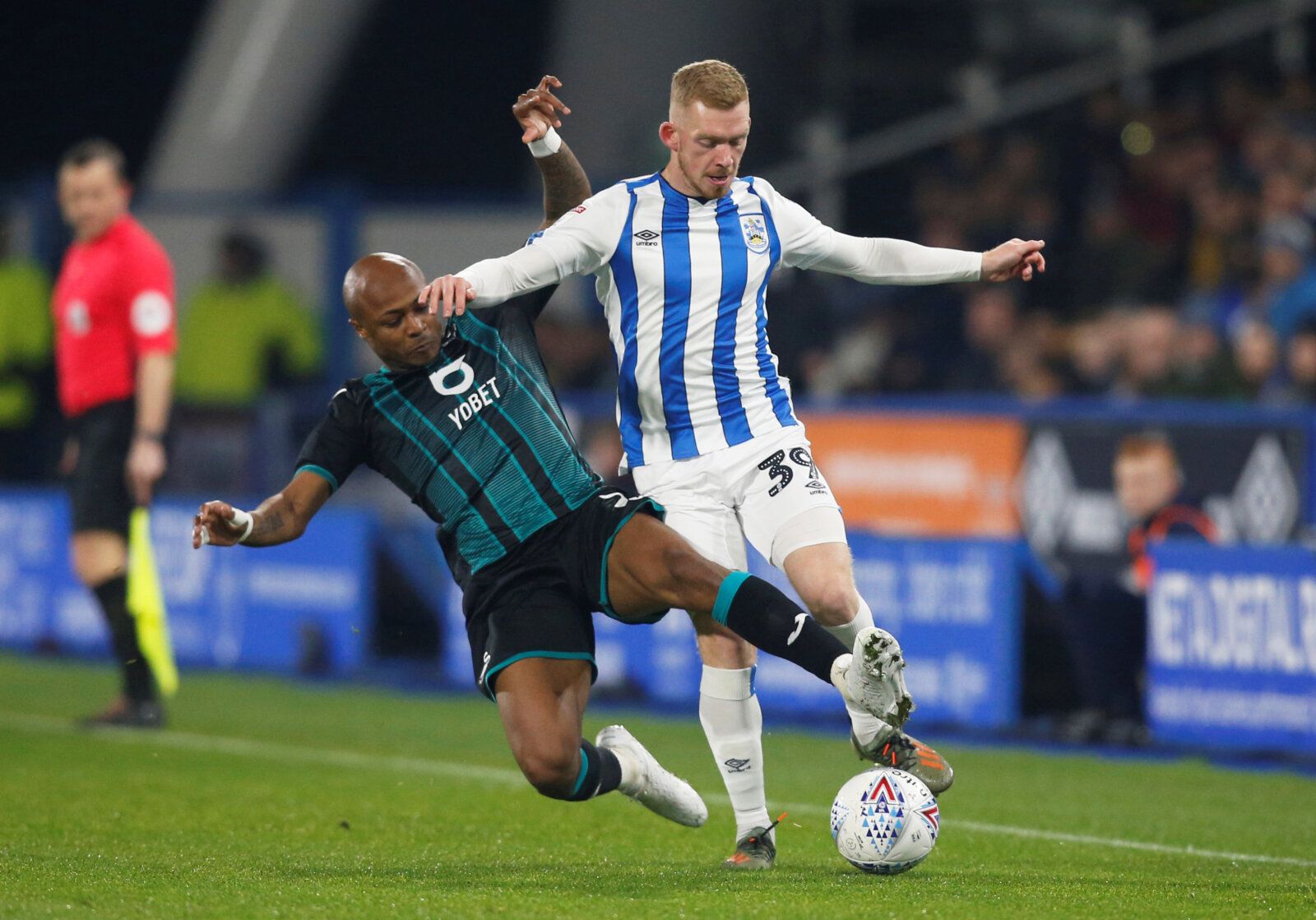 Soccer Football - Championship - Huddersfield Town v Swansea City - John Smith's Stadium, Huddersfield, Britain - November 26, 2019  Huddersfield Town's Lewis O'Brien in action with Swansea City's Andre Ayew  Action Images/Ed Sykes  EDITORIAL USE ONLY. No use with unauthorized audio, video, data, fixture lists, club/league logos or 