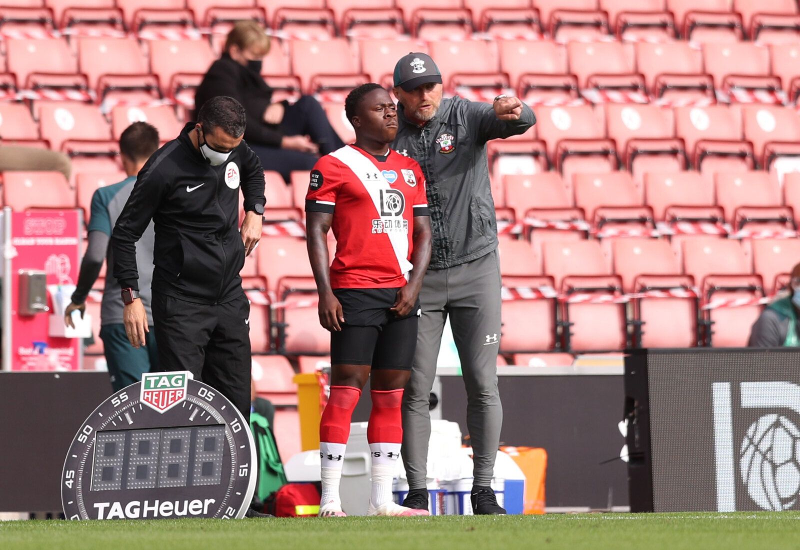 Soccer Football - Premier League - Southampton v Sheffield United - St Mary's Stadium, Southampton, Britain - July 26, 2020  Southampton manager Ralph Hasenhuttl talks to Michael Obafemi during the match, as play resumes behind closed doors following the outbreak of the coronavirus disease (COVID-19) Pool via REUTERS/Naomi Baker EDITORIAL USE ONLY. No use with unauthorized audio, video, data, fixture lists, club/league logos or 'live' services. Online in-match use limited to 75 images, no video 