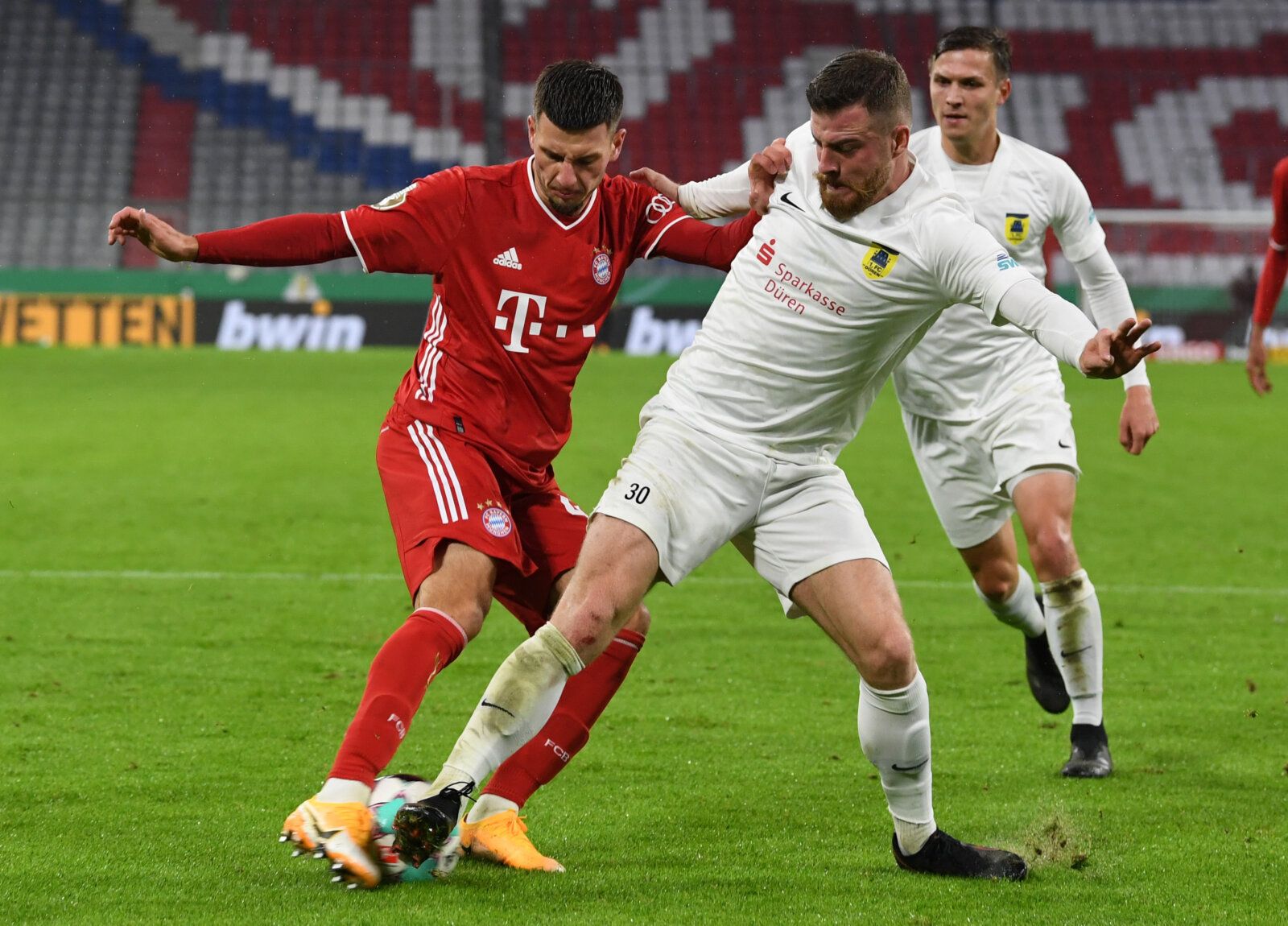 Soccer Football - DFB Cup - FC Duren v Bayern Munich - Allianz Arena, Munich, Germany - October 15, 2020  Bayern Munich's Leon Dajaku in action with FC Duren's Markus Wipperfurth  REUTERS / Andreas Gebert  DFB regulations prohibit any use of photographs as image sequences and/or quasi-video