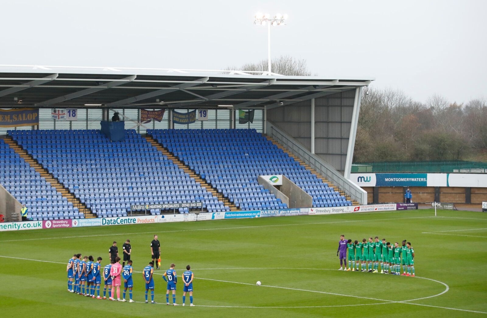 Soccer Football - FA Cup Second Round - Shrewsbury Town v Oxford City - Montgomery Waters Meadow, Shrewsbury, Britain - November 29, 2020 General view of the teams during a minute's silence in memory of Diego Maradona before the match Action Images/Andrew Boyers EDITORIAL USE ONLY. No use with unauthorized audio, video, data, fixture lists, club/league logos or 'live' services. Online in-match use limited to 75 images, no video emulation. No use in betting, games or single club /league/player pu
