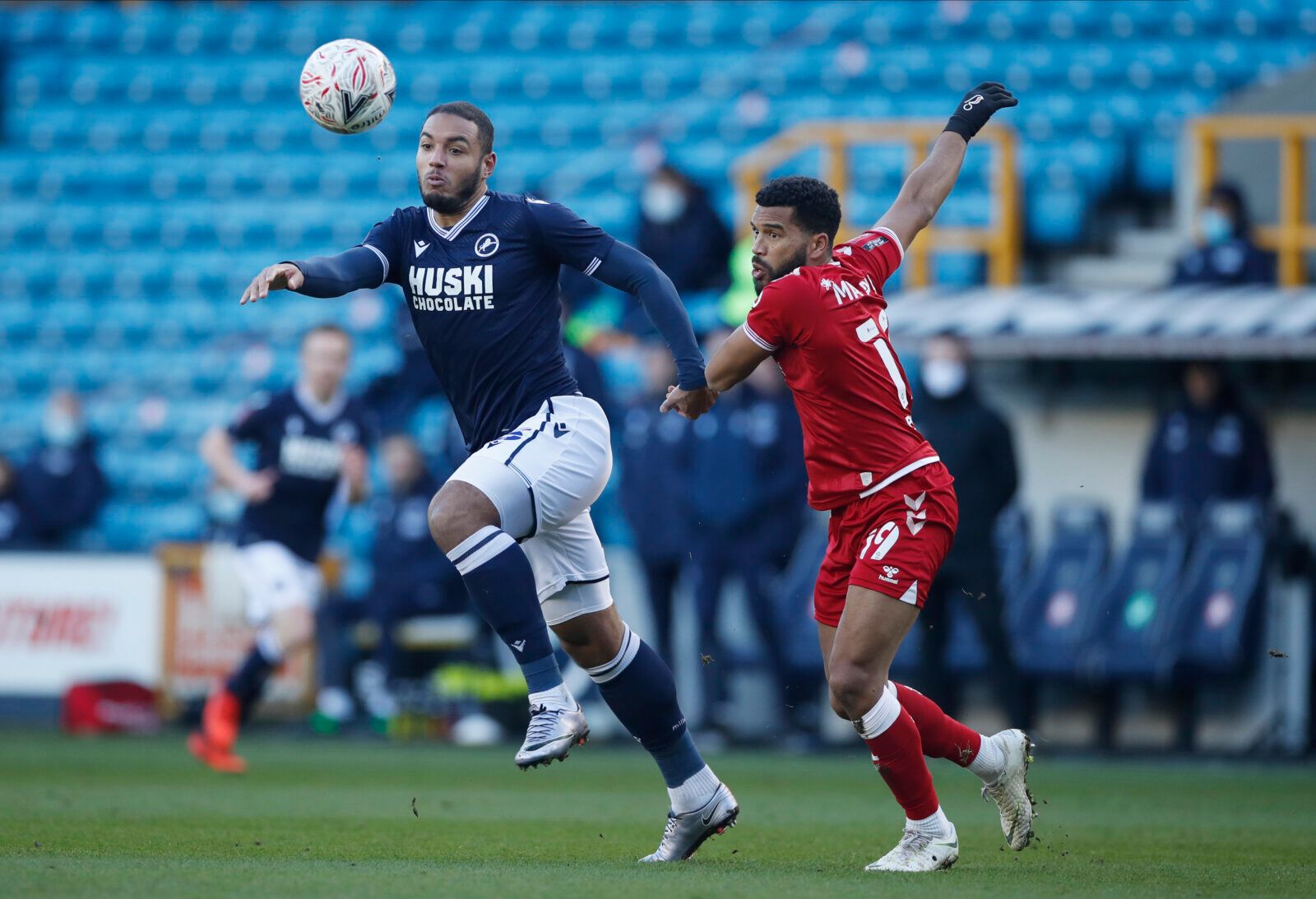 Soccer Football - FA Cup - Fourth Round - Millwall v Bristol City - The Den, London, Britain - January 23, 2021 Millwall's Kenneth Zohore and Bristol City's Adrian Mariappa Action Images/Paul Childs