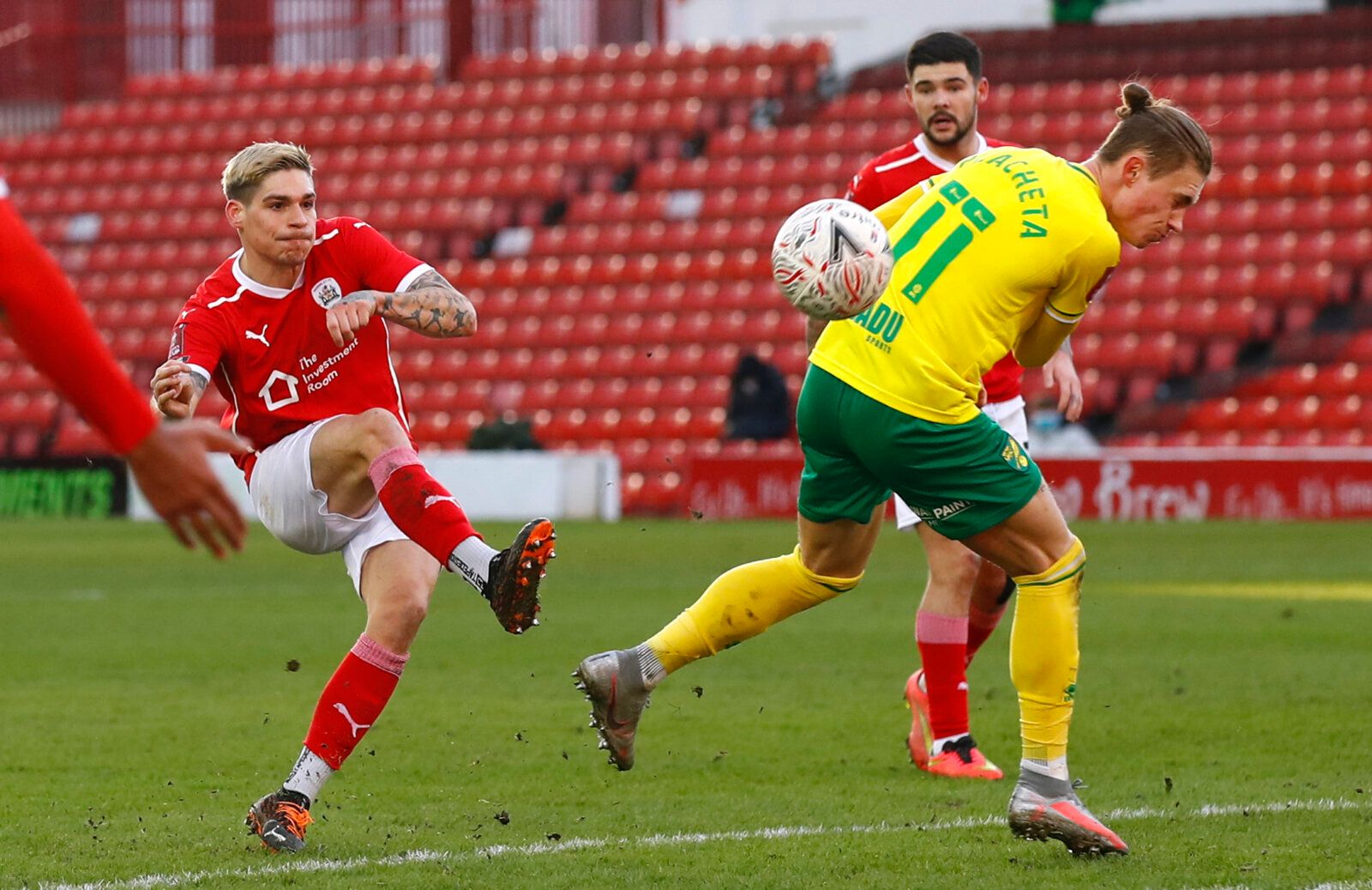 Soccer Football - FA Cup - Fourth Round - Barnsley v Norwich City - Oakwell, Barnsley, Britain - January 23, 2021 Barnsley's Dominik Frieser in action with Norwich City's Przemyslaw Placheta Action Images/Jason Cairnduff