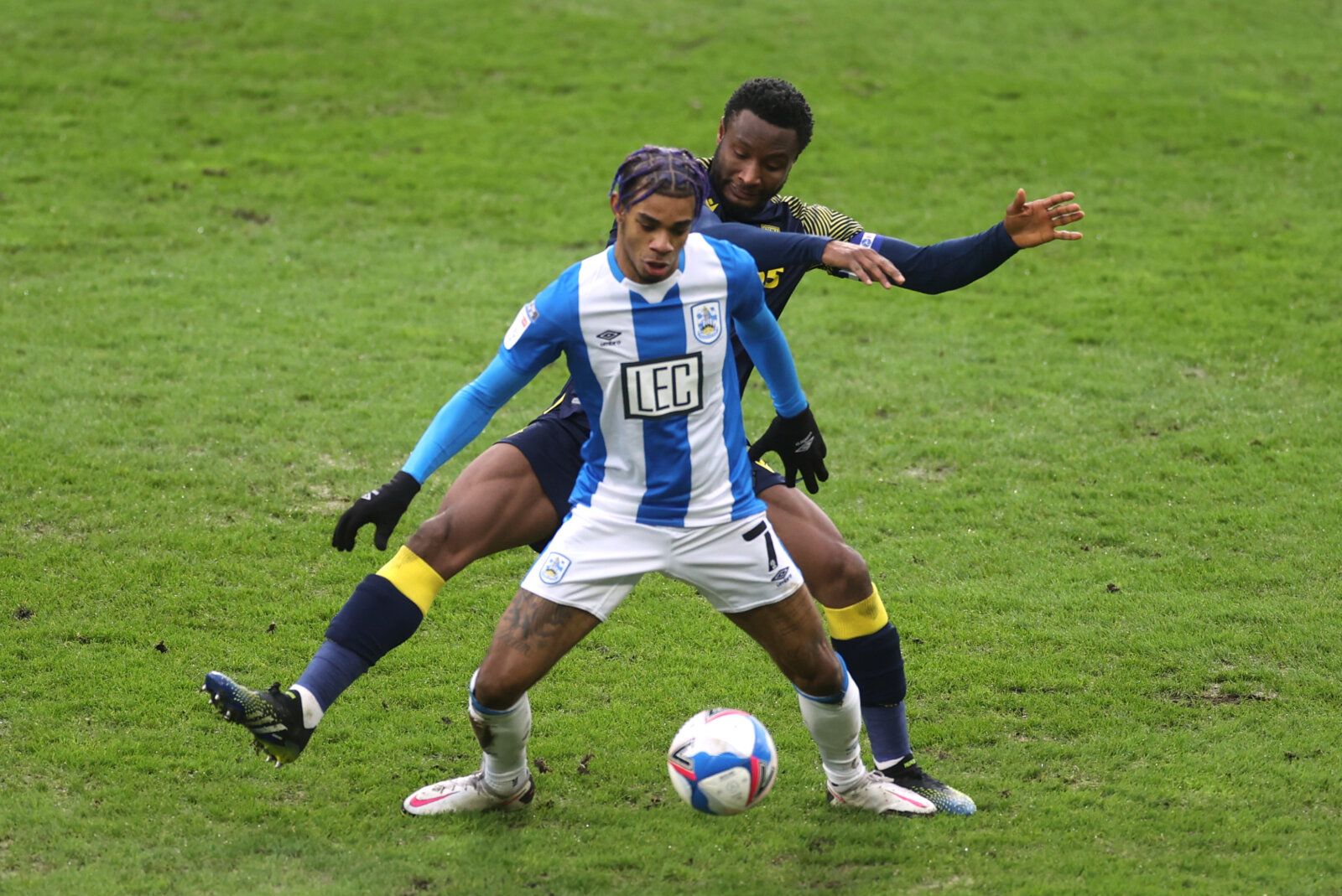 Soccer Football - Championship - Huddersfield Town v Stoke City - John Smith's Stadium, Huddersfield, Britain - January 30, 2021 Huddersfield Town's Juninho Bacuna in action with Stoke City's John Obi Mikel Action Images/Carl Recine EDITORIAL USE ONLY. No use with unauthorized audio, video, data, fixture lists, club/league logos or 'live' services. Online in-match use limited to 75 images, no video emulation. No use in betting, games or single club /league/player publications.  Please contact yo