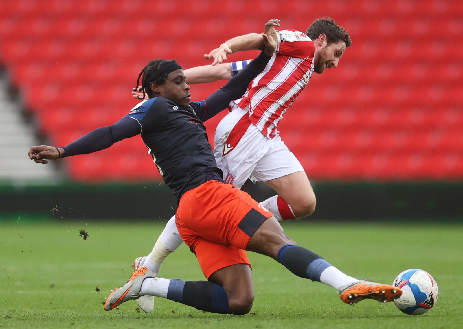 Soccer Football - Championship - Stoke City v Luton Town - bet365 Stadium, Stoke-on-Trent, Britain - February 20, 2021 Stoke City's Joe Allen in action with Luton Town's Pelly Ruddock Action Images/Carl Recine EDITORIAL USE ONLY. No use with unauthorized audio, video, data, fixture lists, club/league logos or 'live' services. Online in-match use limited to 75 images, no video emulation. No use in betting, games or single club /league/player publications.  Please contact your account representati
