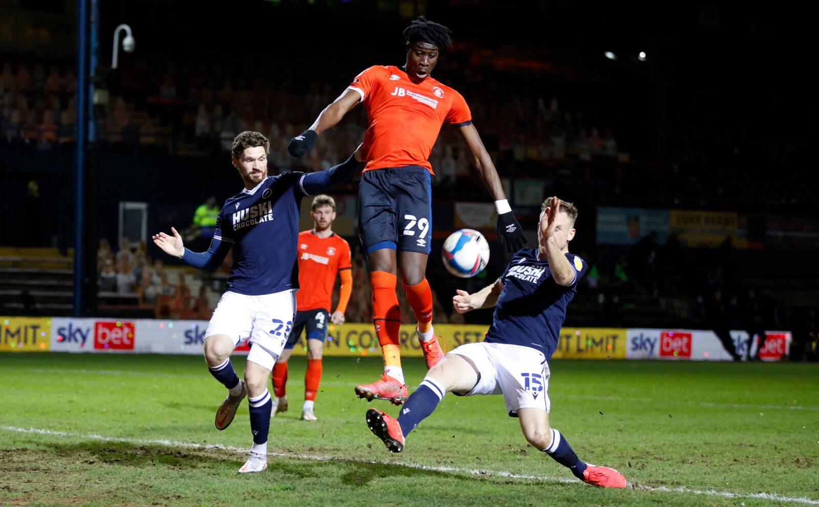 Soccer Football - Championship - Luton Town v Millwall - Kenilworth Road, Luton, Britain - February 23, 2021 Luton Town's Elijah Adebayo in action with Millwall's Alex Pearce and George Evans Action Images/John Sibley EDITORIAL USE ONLY. No use with unauthorized audio, video, data, fixture lists, club/league logos or 'live' services. Online in-match use limited to 75 images, no video emulation. No use in betting, games or single club /league/player publications.  Please contact your account repr