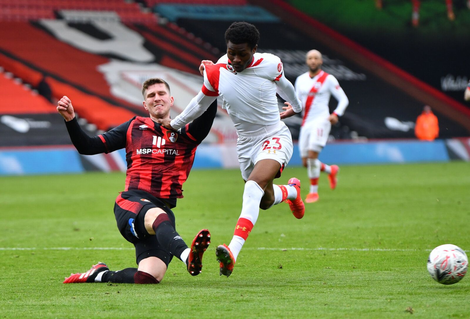 Soccer Football - FA Cup Quarter Final - AFC Bournemouth v Southampton - Vitality Stadium, Bournemouth, Britain - March 20, 2021 Southampton's Nathan Tella in action with AFC Bournemouth's Chris Mepham REUTERS/Dylan Martinez