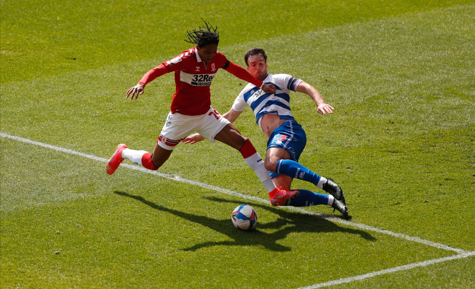 Soccer Football - Championship - Middlesbrough v Queens Park Rangers - Riverside Stadium, Middlesbrough, Britain - April 17, 2021 Queens Park Rangers' Lee Wallace in action with Middlesbrough's Djed Spence Action Images/Lee Smith EDITORIAL USE ONLY. No use with unauthorized audio, video, data, fixture lists, club/league logos or 'live' services. Online in-match use limited to 75 images, no video emulation. No use in betting, games or single club /league/player publications.  Please contact your 
