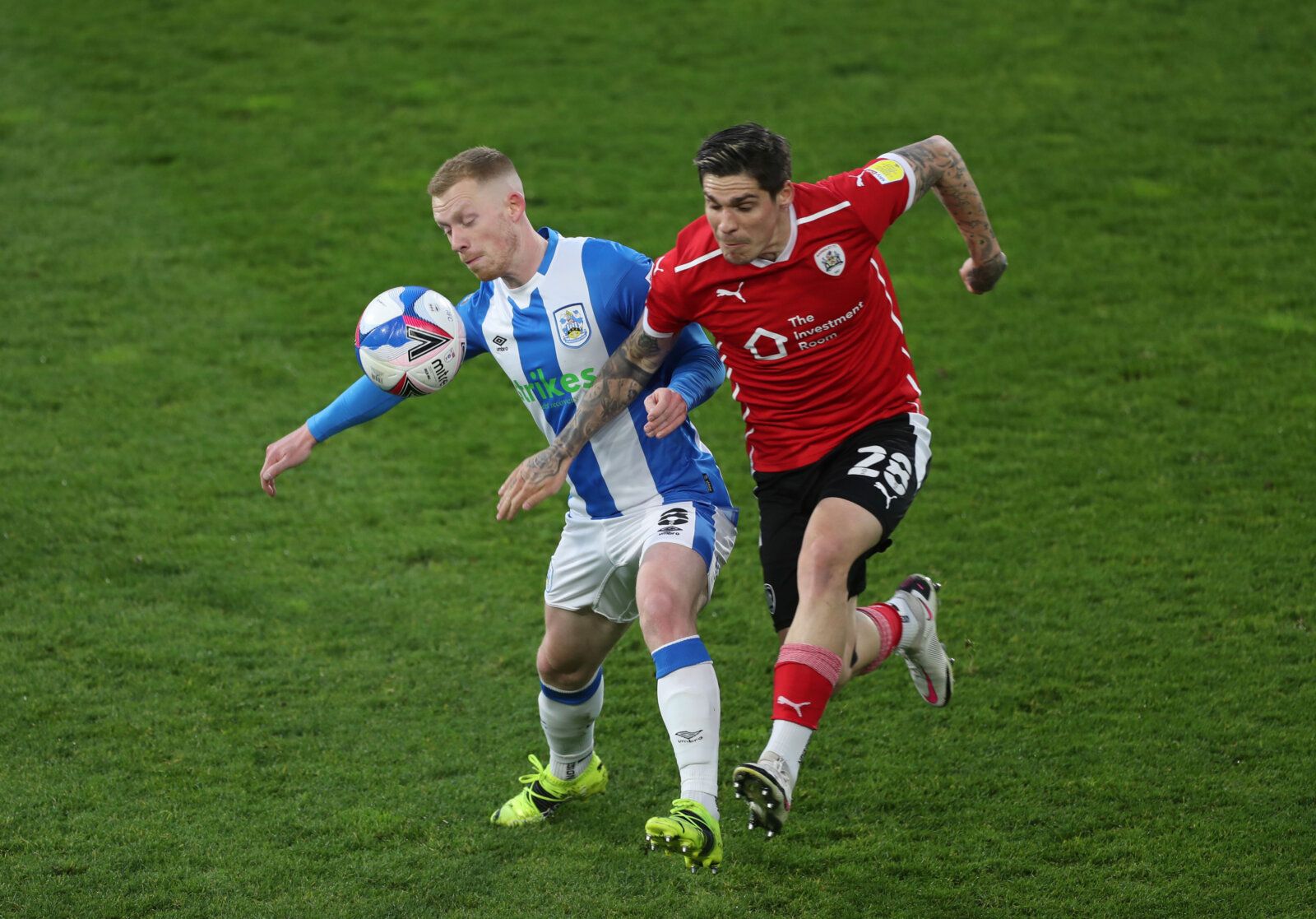 Soccer Football - Championship - Huddersfield Town v Barnsley - John Smith's Stadium, Huddersfield, Britain - April 21, 2021 Huddersfield Town's Lewis O'Brien in action with Barnsley's Dominik Frieser Action Images/Lee Smith EDITORIAL USE ONLY. No use with unauthorized audio, video, data, fixture lists, club/league logos or 'live' services. Online in-match use limited to 75 images, no video emulation. No use in betting, games or single club /league/player publications.  Please contact your accou